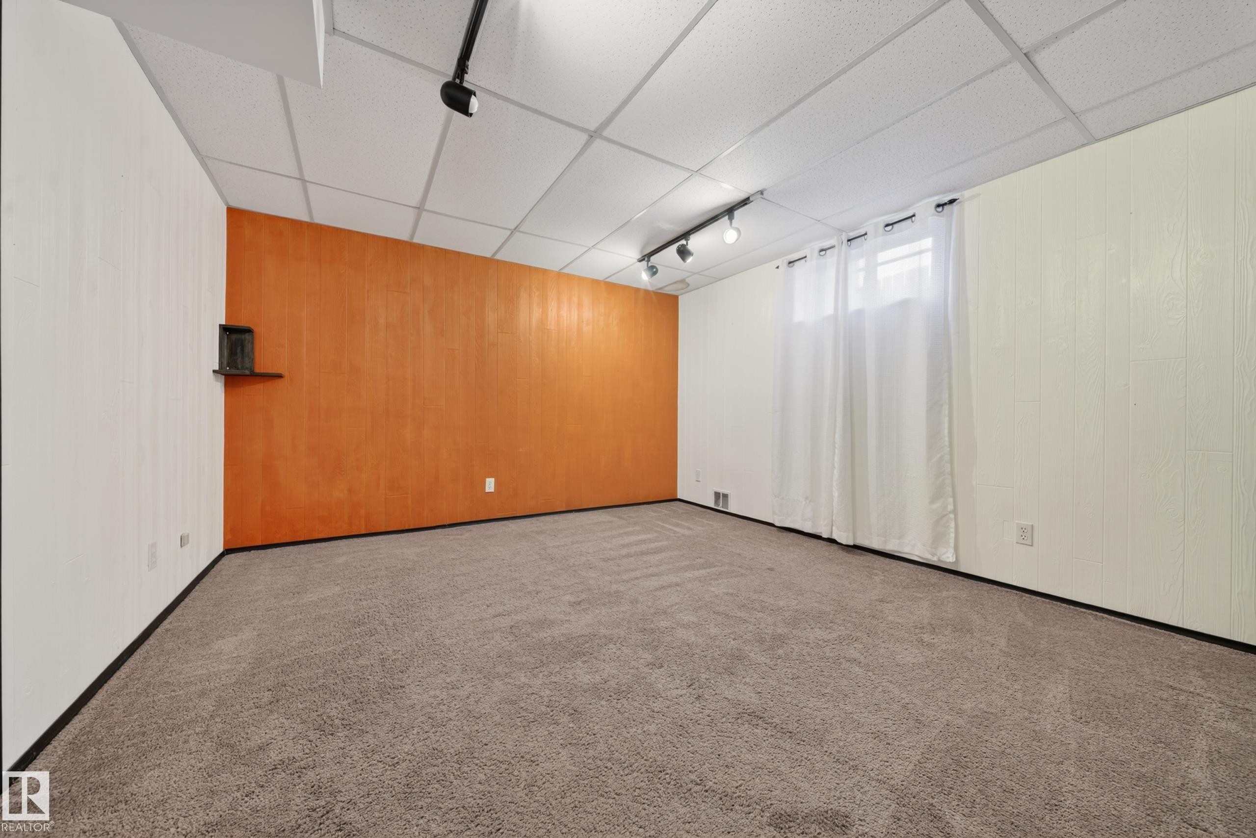 Carpeted room featuring an accent wall, track lighting, and a drop ceiling - 1767 61 Street, Edmonton, AB - Indoor Photo Showing Other Room