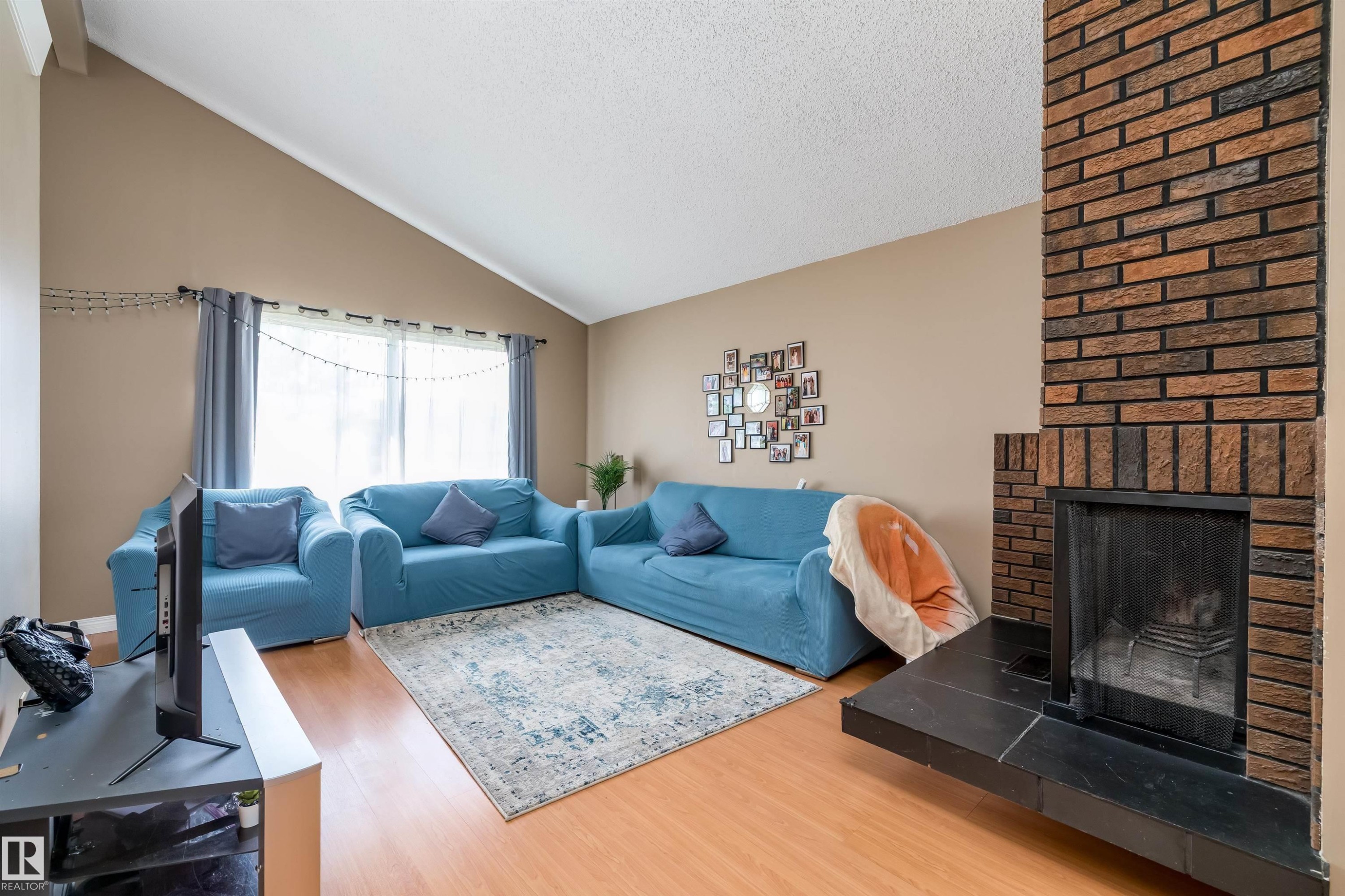 3620 42A Avenue, Edmonton, AB - Indoor Photo Showing Living Room With Fireplace