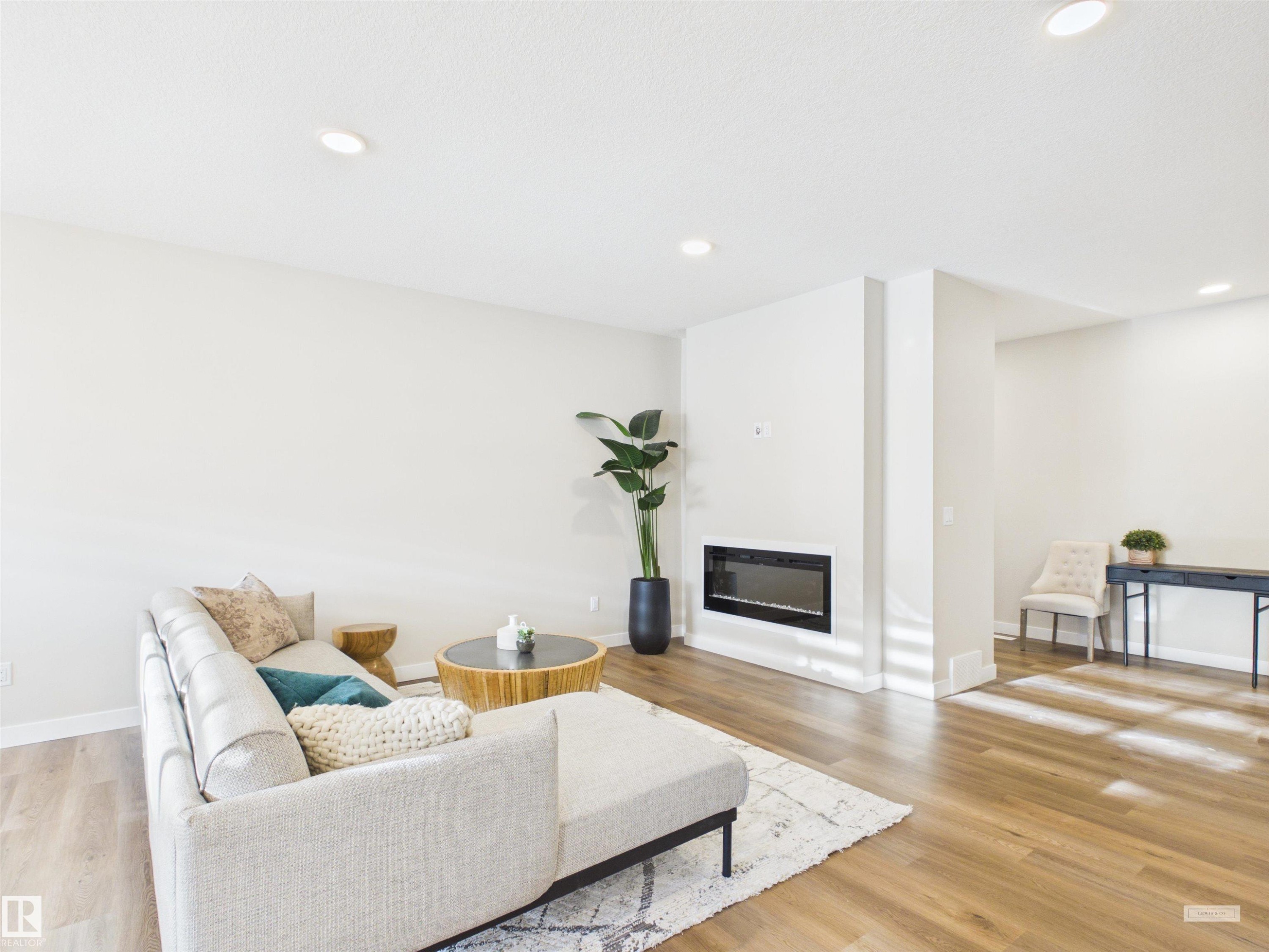 3 Emerson Landing, Spruce Grove, AB - Indoor Photo Showing Living Room With Fireplace