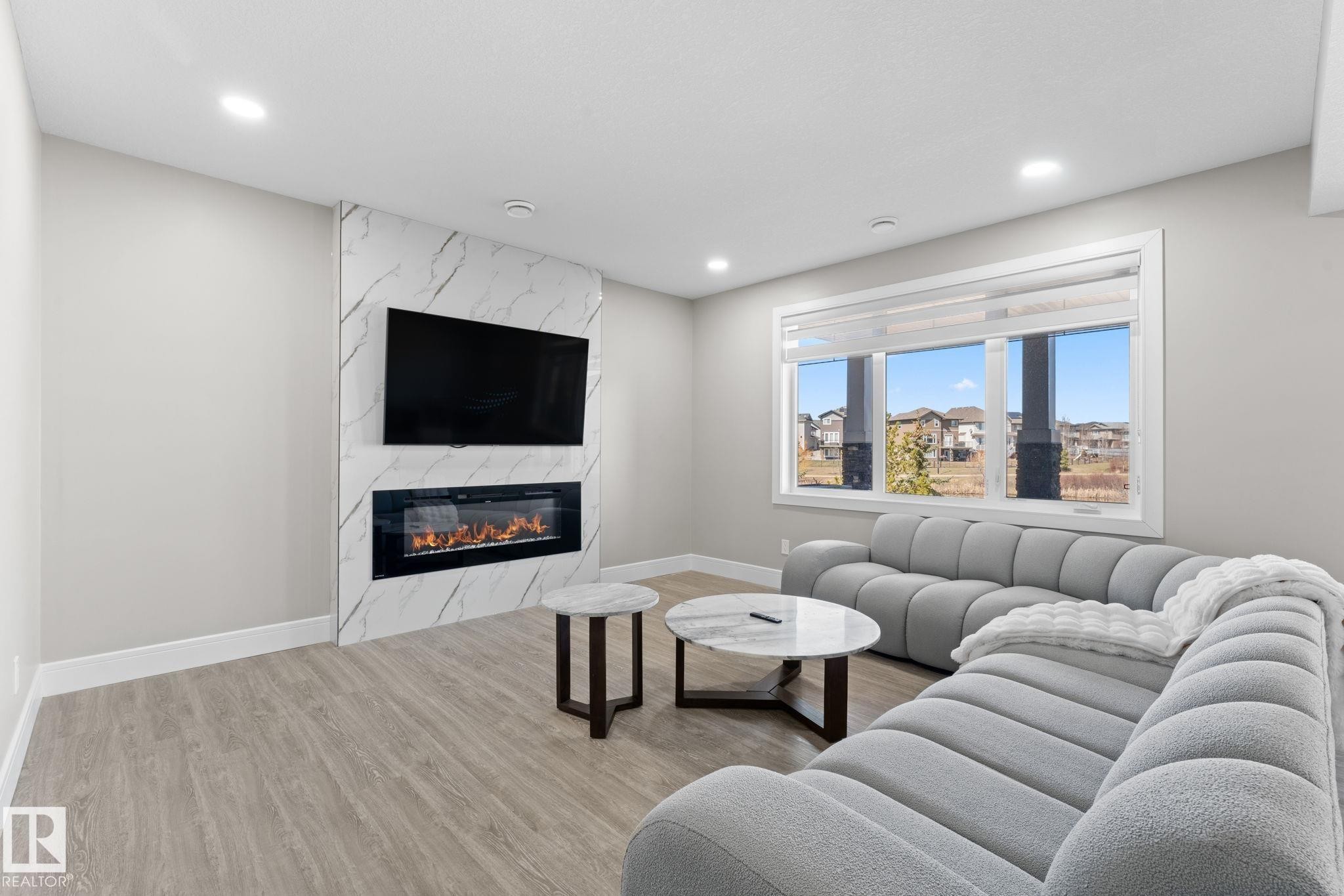 7640 179 Avenue, Edmonton, AB - Indoor Photo Showing Living Room With Fireplace