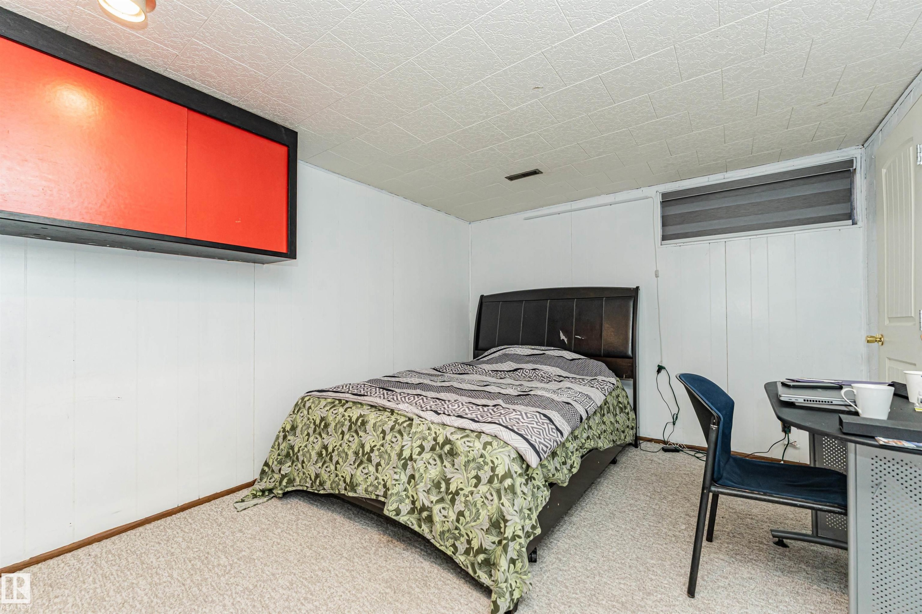 The room features white paneling on the walls and a textured ceiling - 10412 39 Avenue, Edmonton, AB - Indoor Photo Showing Bedroom
