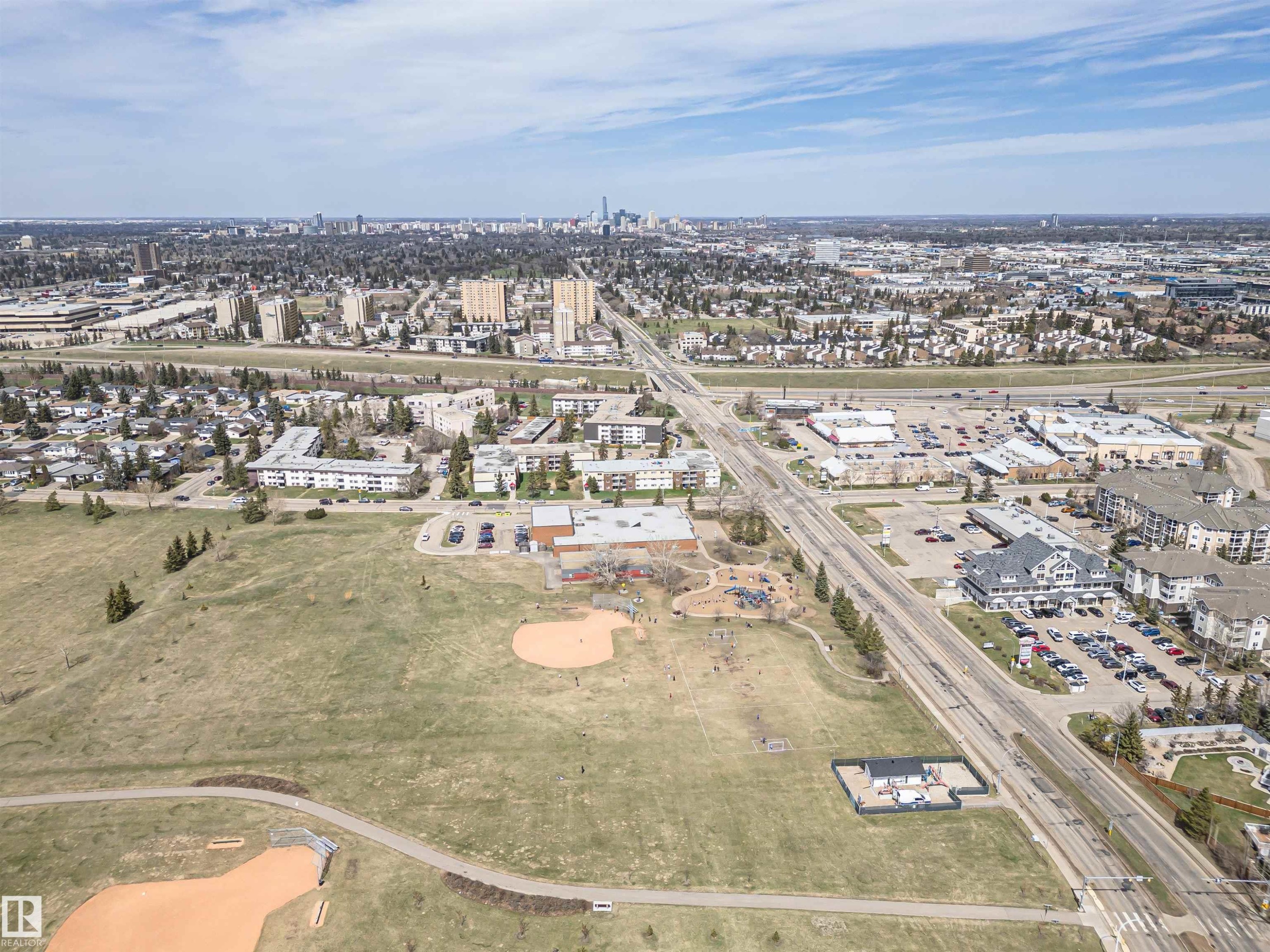 Expansive green space featuring two baseball diamonds and a paved walking path - 10412 39 Avenue, Edmonton, AB - Outdoor With View