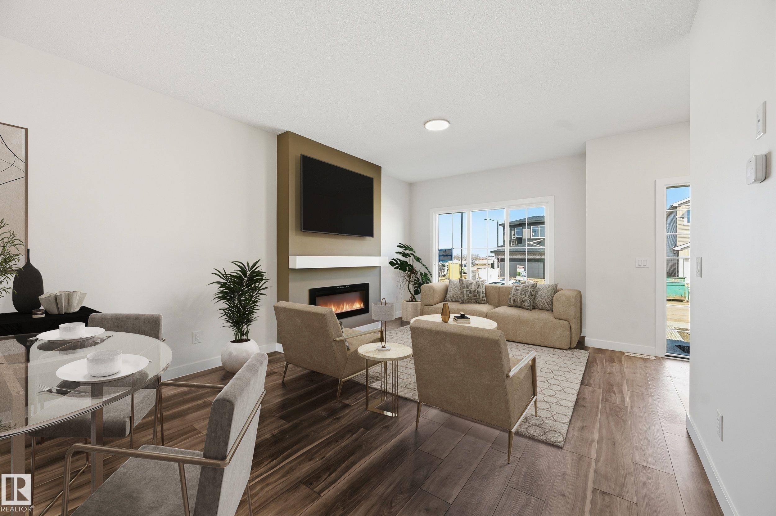 243 Wattle Road, Leduc, AB - Indoor Photo Showing Dining Room With Fireplace