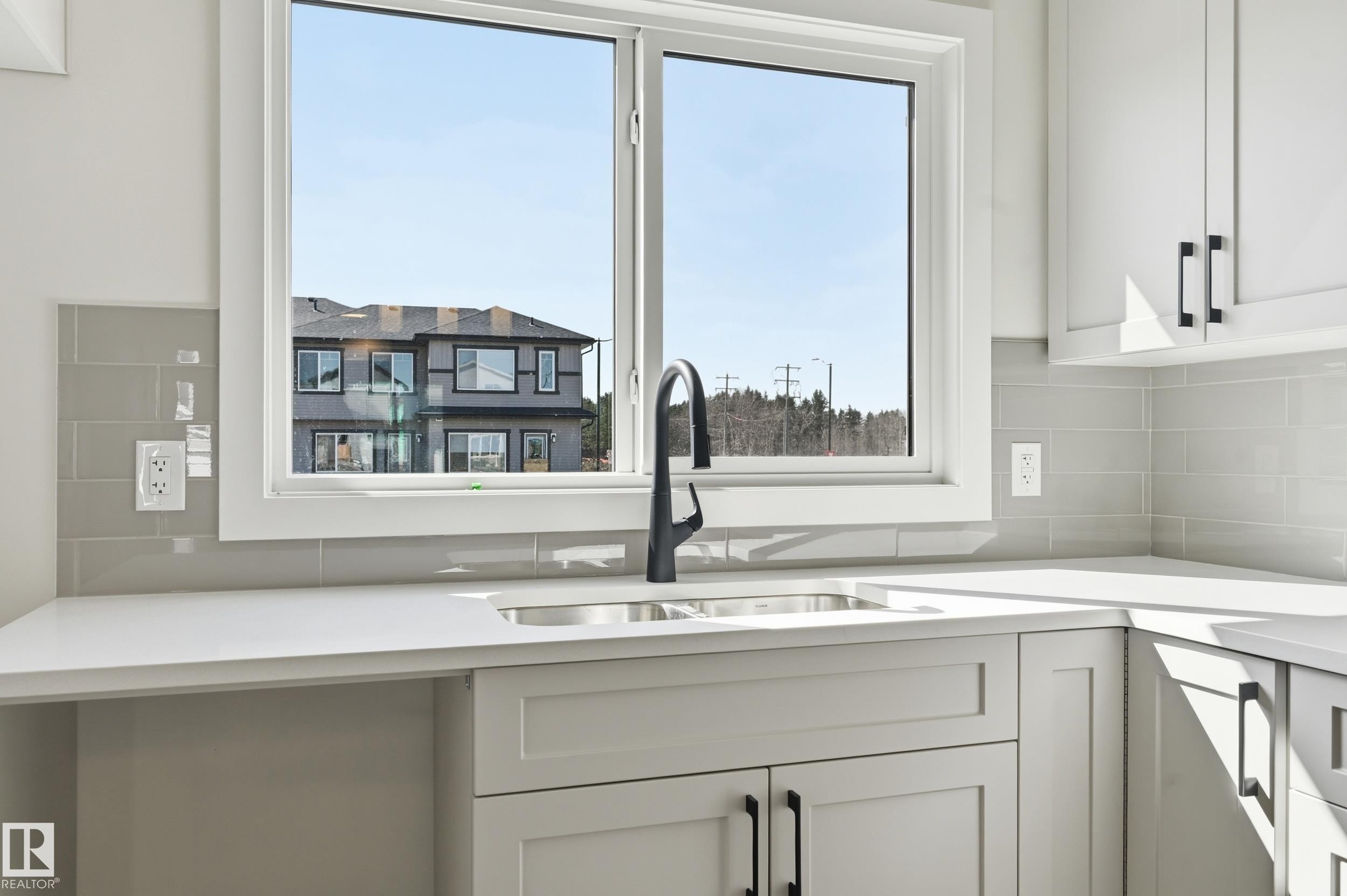 243 Wattle Road, Leduc, AB - Indoor Photo Showing Kitchen With Double Sink