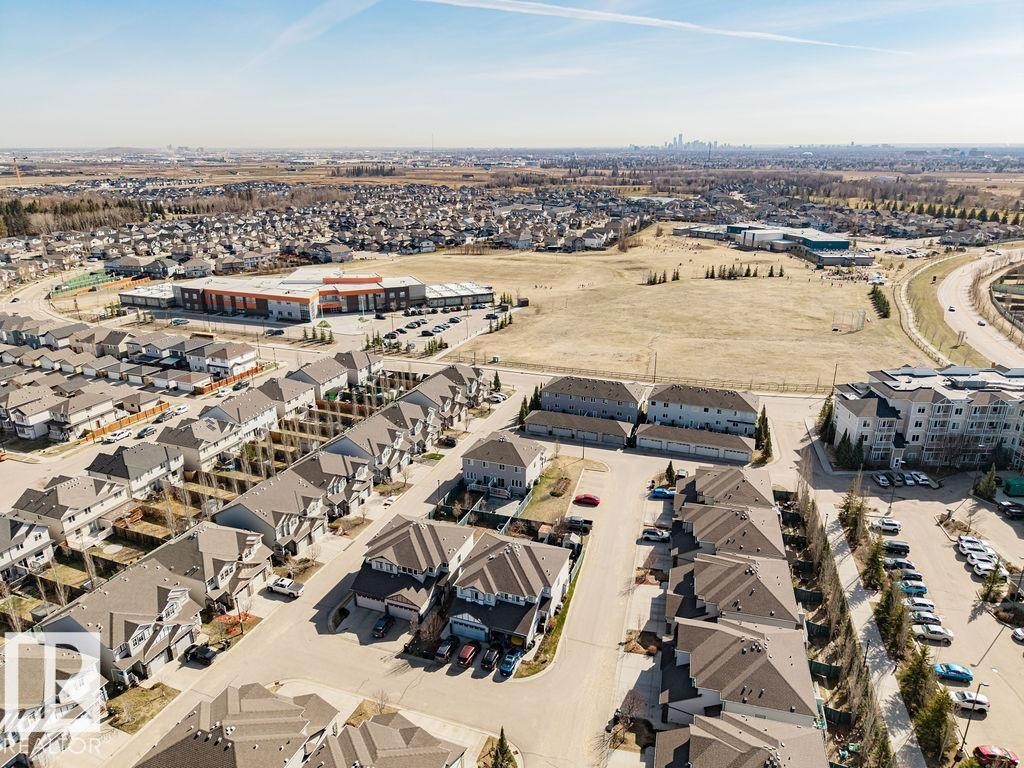Aerial perspective showcasing a residential development with varied housing types - 14 9350 211 Street, Edmonton, AB - Outdoor With View