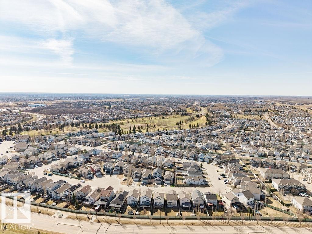 Expansive aerial perspective showcasing a residential development with numerous detached homes - 14 9350 211 Street, Edmonton, AB - Outdoor With View