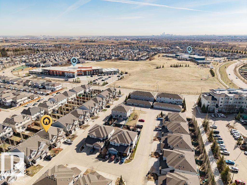 Aerial perspective showcasing a residential neighborhood with a variety of housing types - 14 9350 211 Street, Edmonton, AB - Outdoor With View