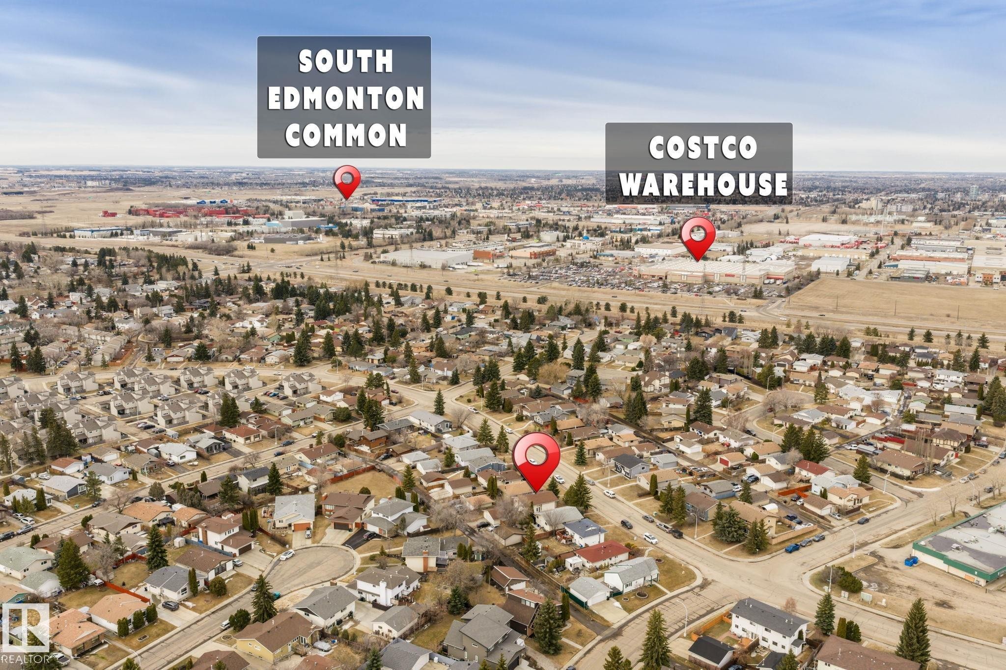 Aerial perspective of a residential area featuring single-family homes and mature trees - 1566 Lakewood Road Nw, Edmonton, AB - Outdoor With View