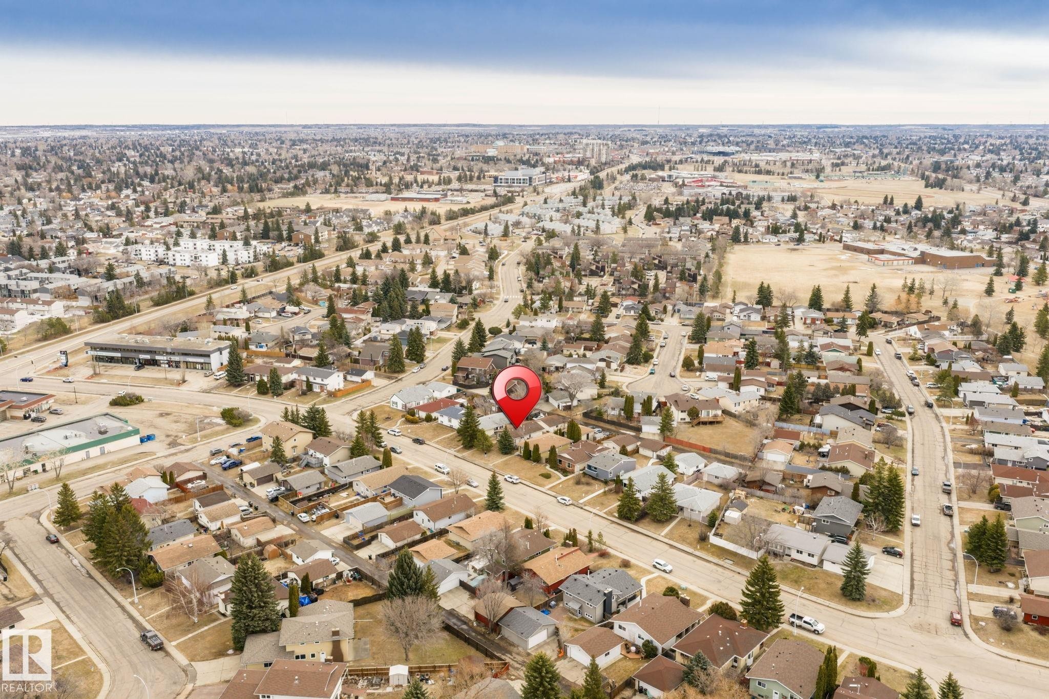 Aerial perspective showcasing a residential neighborhood with established homes and mature trees - 1566 Lakewood Road Nw, Edmonton, AB - Outdoor With View