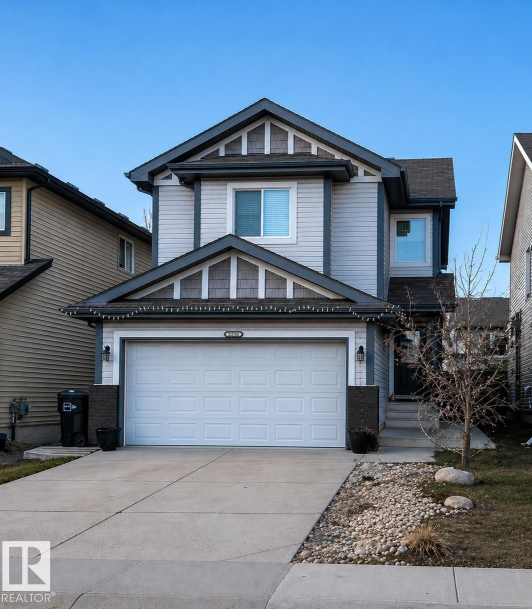 Two-story residence featuring light gray siding and dark gray trim - 3336 17B Avenue Nw, Edmonton, AB - Outdoor