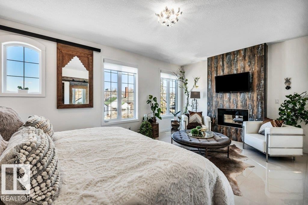 10920 96 Street, Edmonton, AB - Indoor Photo Showing Bedroom With Fireplace