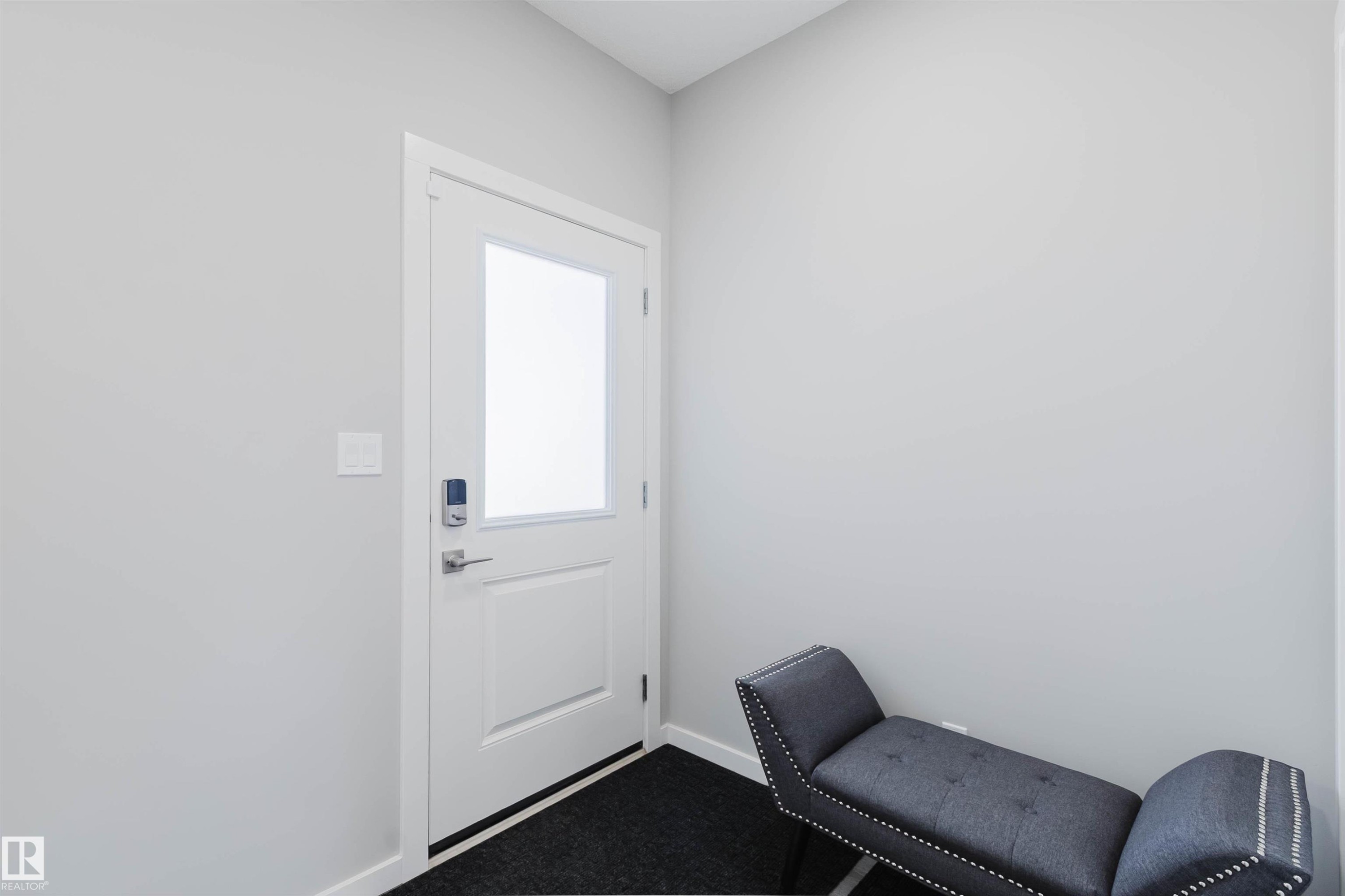 Entryway featuring a white door with an integrated frosted glass panel and contemporary digital lock - 343 Edgemont Drive, Edmonton, AB - Indoor Photo Showing Other Room