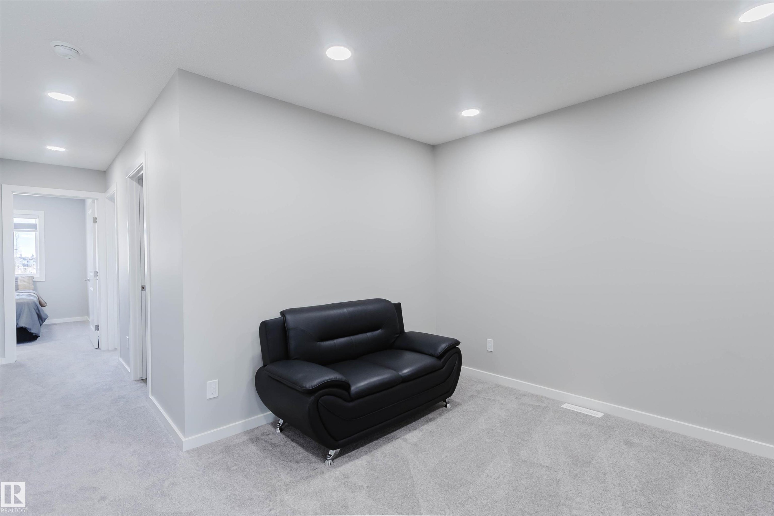 Neutral gray walls complement plush gray carpeting throughout this versatile space - 343 Edgemont Drive, Edmonton, AB - Indoor