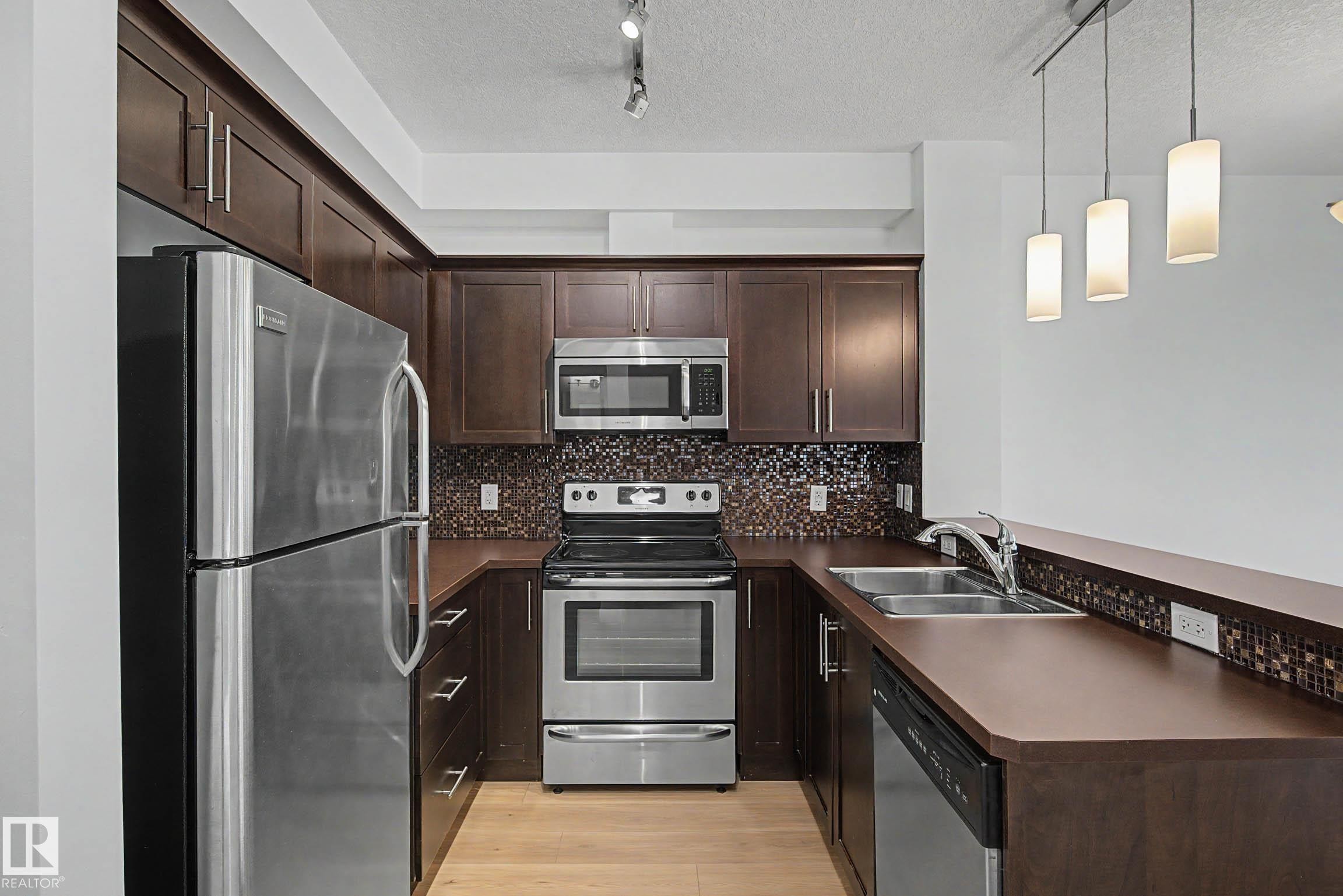 123 2584 Anderson Way, Edmonton, AB - Indoor Photo Showing Kitchen With Stainless Steel Kitchen With Double Sink With Upgraded Kitchen