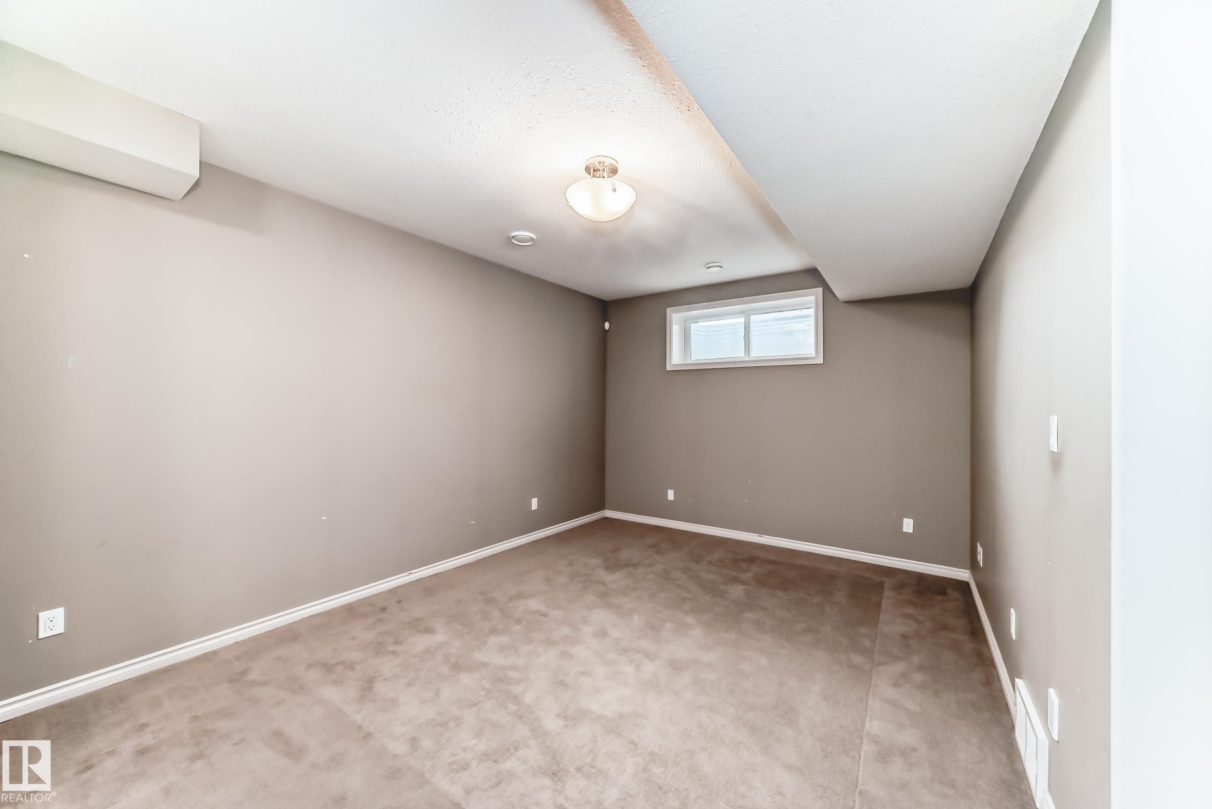 Carpeted room with neutral-toned walls - 6723 19 Avenue, Edmonton, AB - Indoor Photo Showing Other Room