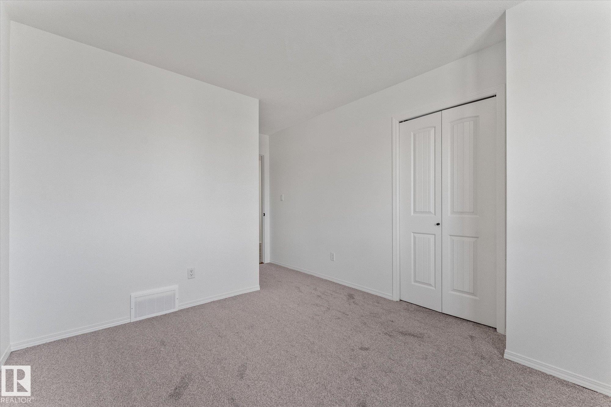 Neutral wall paint with carpet flooring - 326 Silver Berry Road, Edmonton, AB - Indoor Photo Showing Other Room