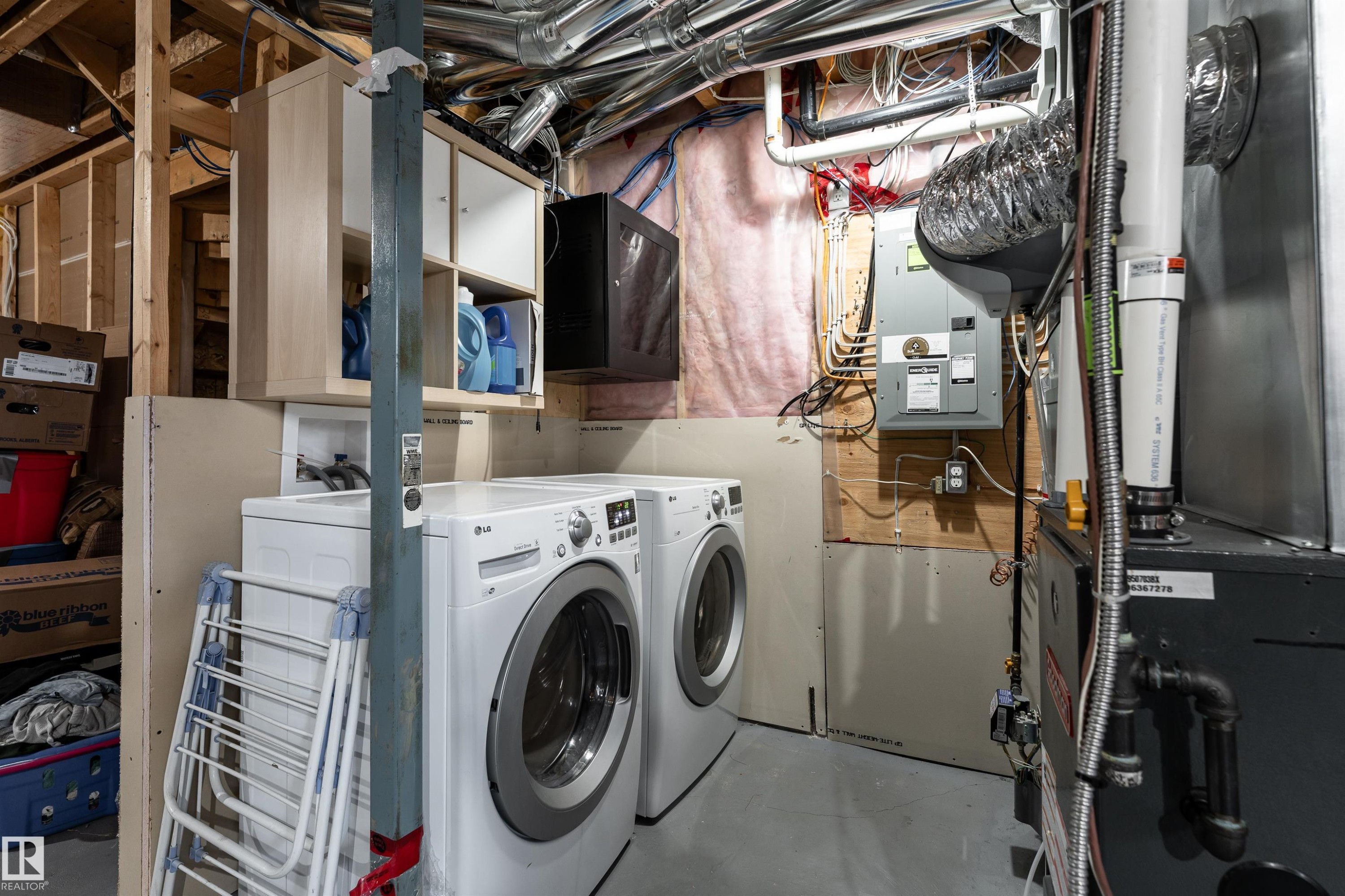 Dedicated laundry area with front-loading appliances - 15 5203 149 Avenue, Edmonton, AB - Indoor Photo Showing Laundry Room