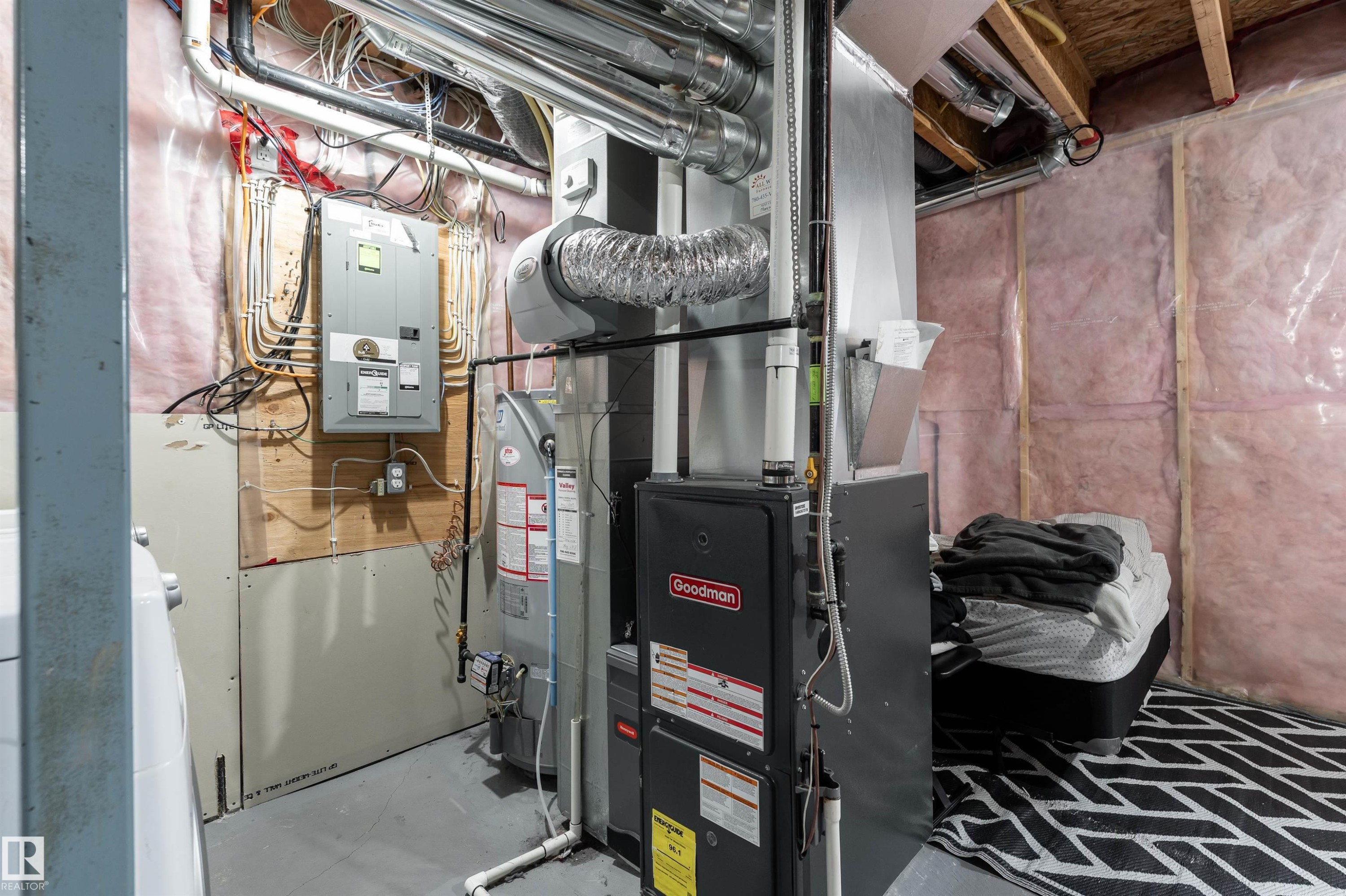 Utility area featuring a furnace, water heater, and electrical panels - 15 5203 149 Avenue, Edmonton, AB - Indoor Photo Showing Basement