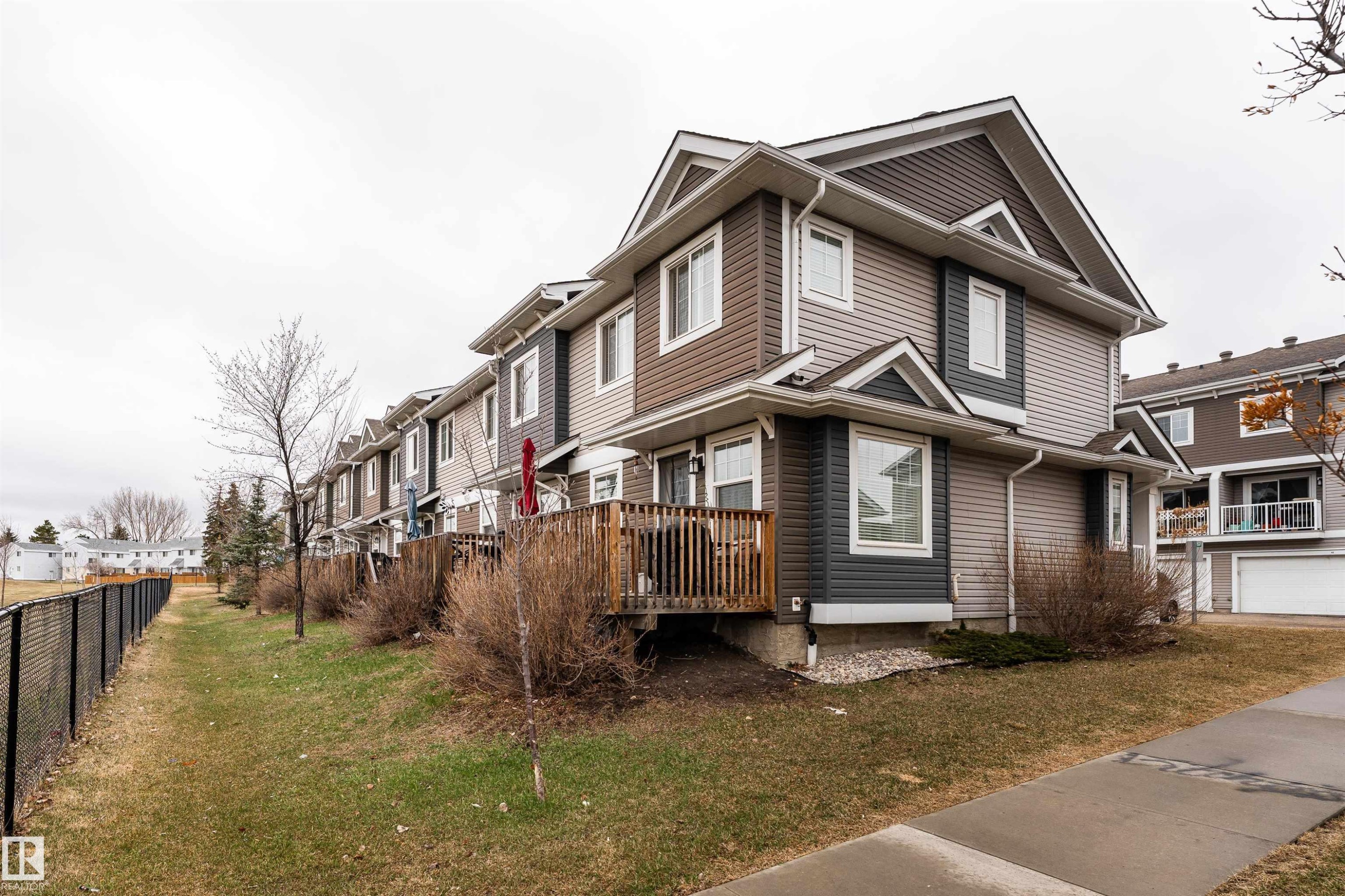 Contemporary two-story townhouse with multi-tone siding and a gabled roofline - 15 5203 149 Avenue, Edmonton, AB - Outdoor