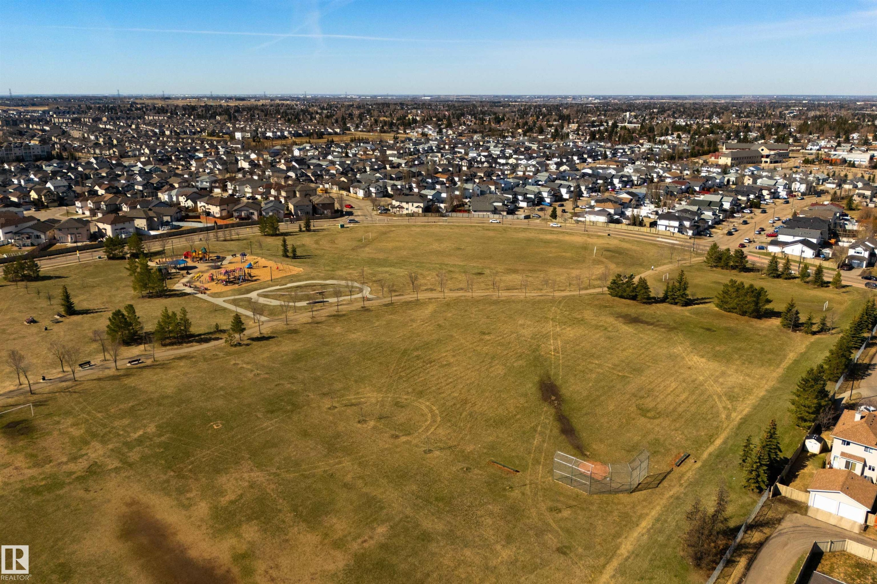 Expansive green space featuring a playground, walking paths, and a baseball diamond - 2923 30 Street, Edmonton, AB - Outdoor With View