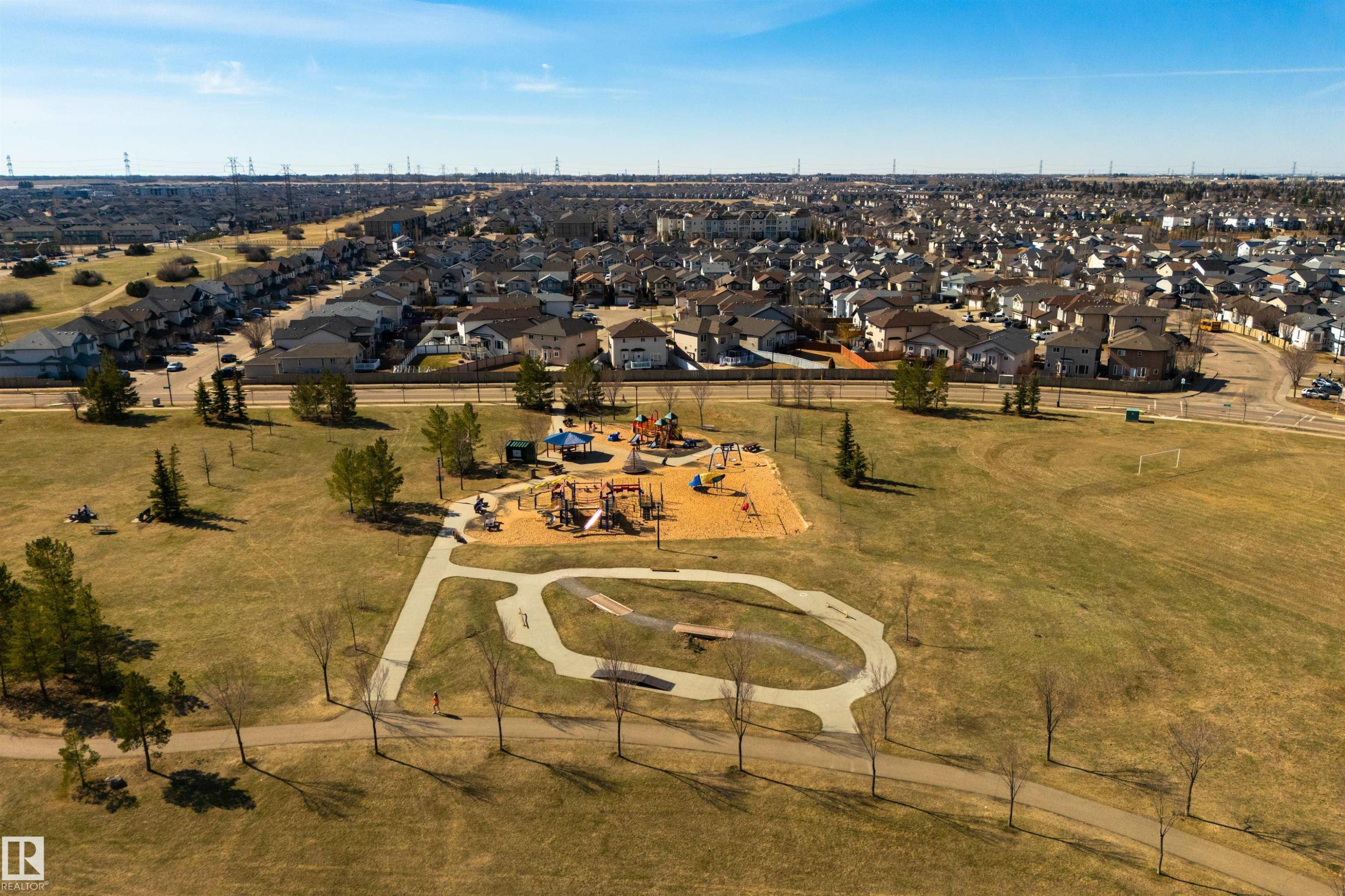 Aerial perspective showcasing a community park with a playground structure and paved walking paths - 2923 30 Street, Edmonton, AB - Outdoor With View