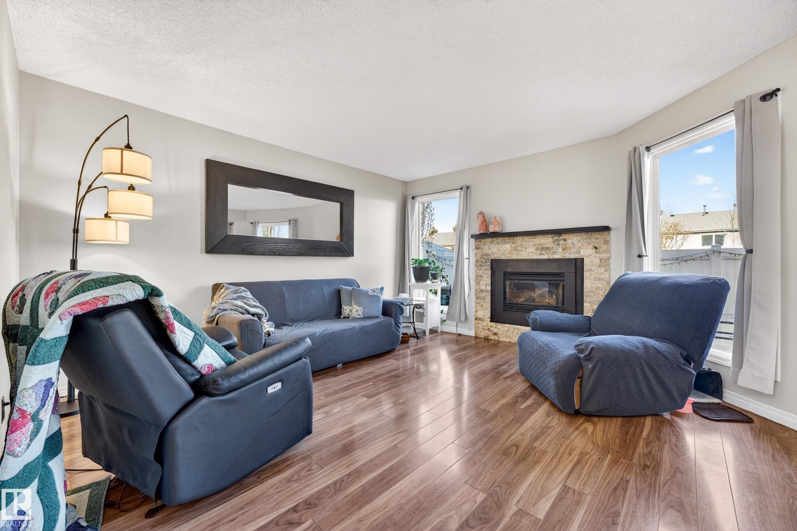 3584 42 Street, Edmonton, AB - Indoor Photo Showing Living Room With Fireplace