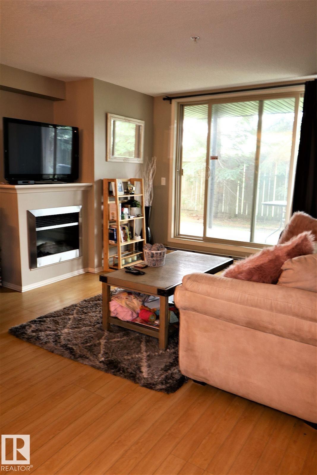 117 17003 67 Avenue, Edmonton, AB - Indoor Photo Showing Living Room With Fireplace