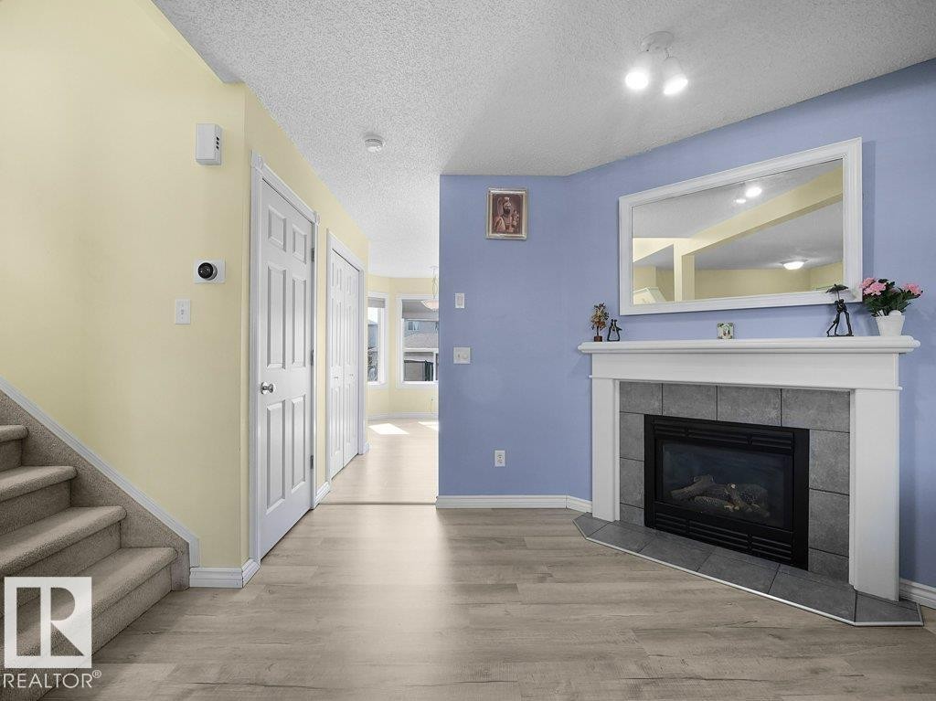 4519 149 Avenue, Edmonton, AB - Indoor Photo Showing Living Room With Fireplace