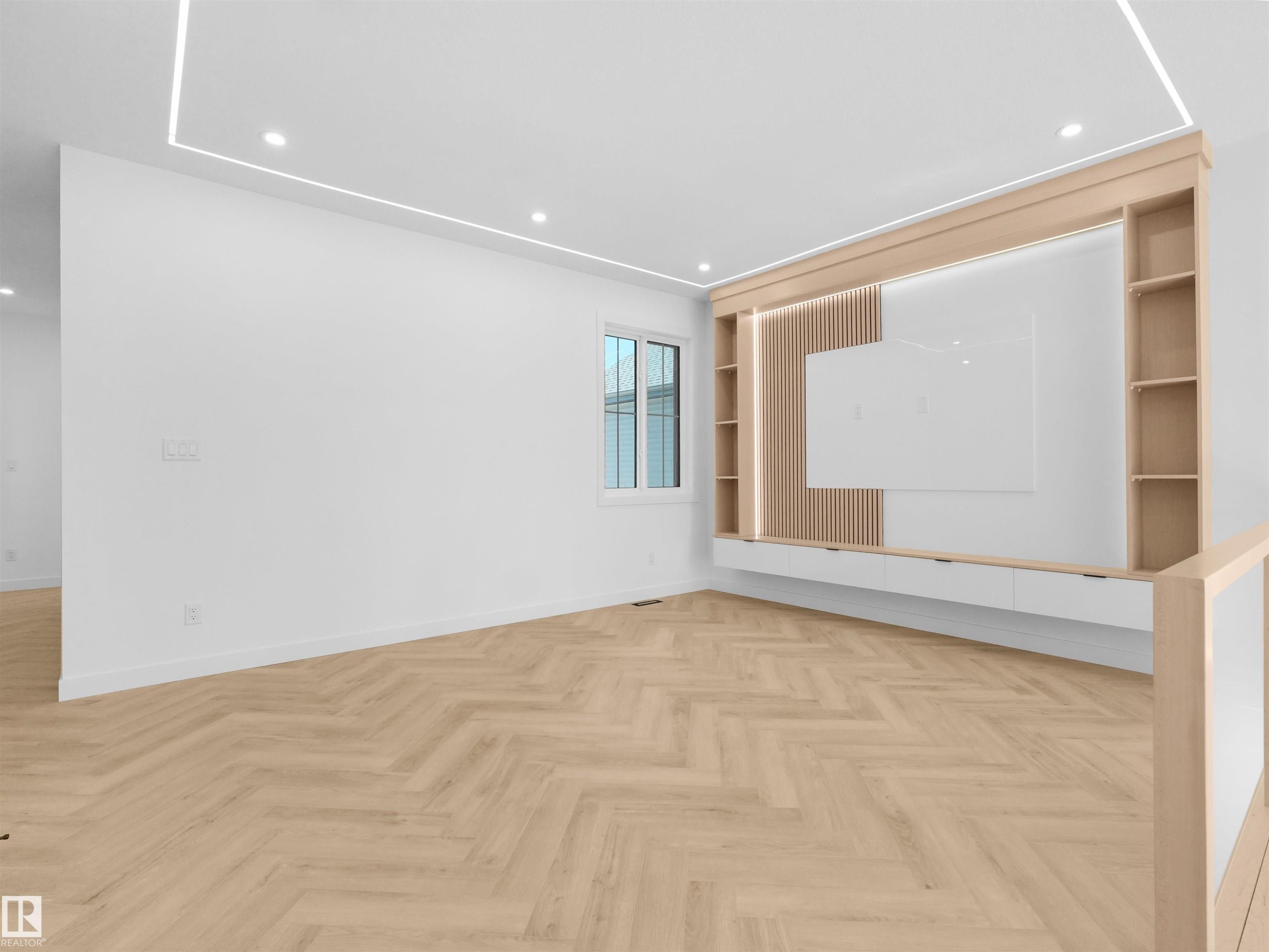 Integrated media wall with wood-finish shelving and paneling - 2070 Collip Crescent Sw, Edmonton, AB - Indoor Photo Showing Other Room