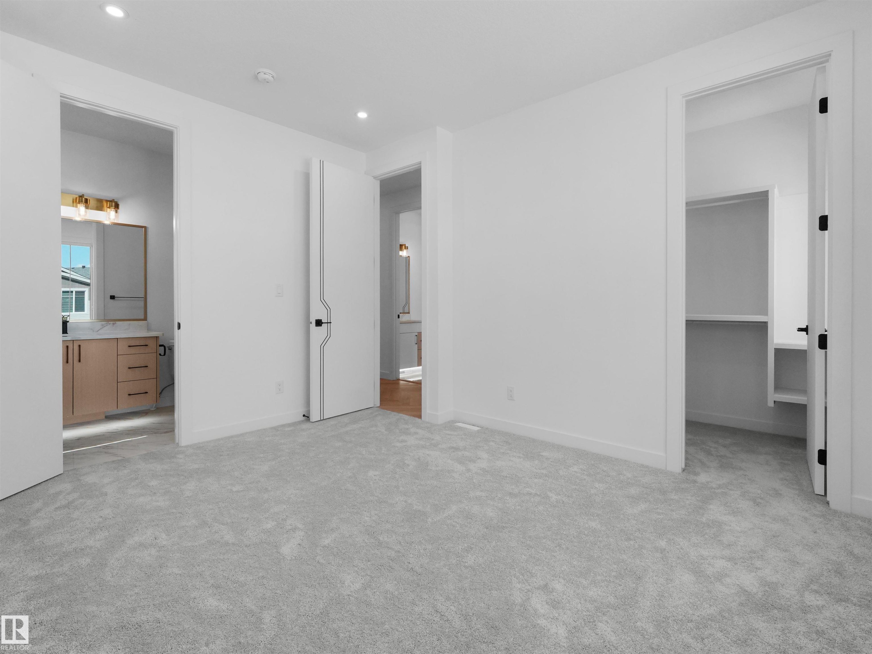 Carpeted room featuring a neutral color palette, recessed lighting, and white trim - 2070 Collip Crescent Sw, Edmonton, AB - Indoor Photo Showing Other Room