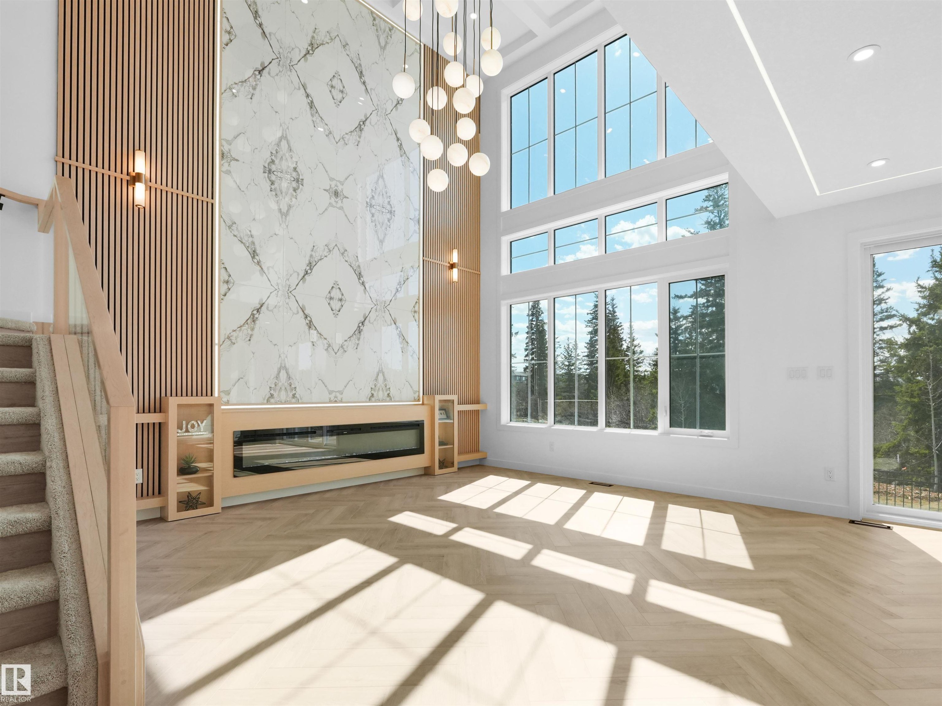 Double-height ceilings complement the expansive wall of windows - 2070 Collip Crescent Sw, Edmonton, AB - Indoor Photo Showing Other Room