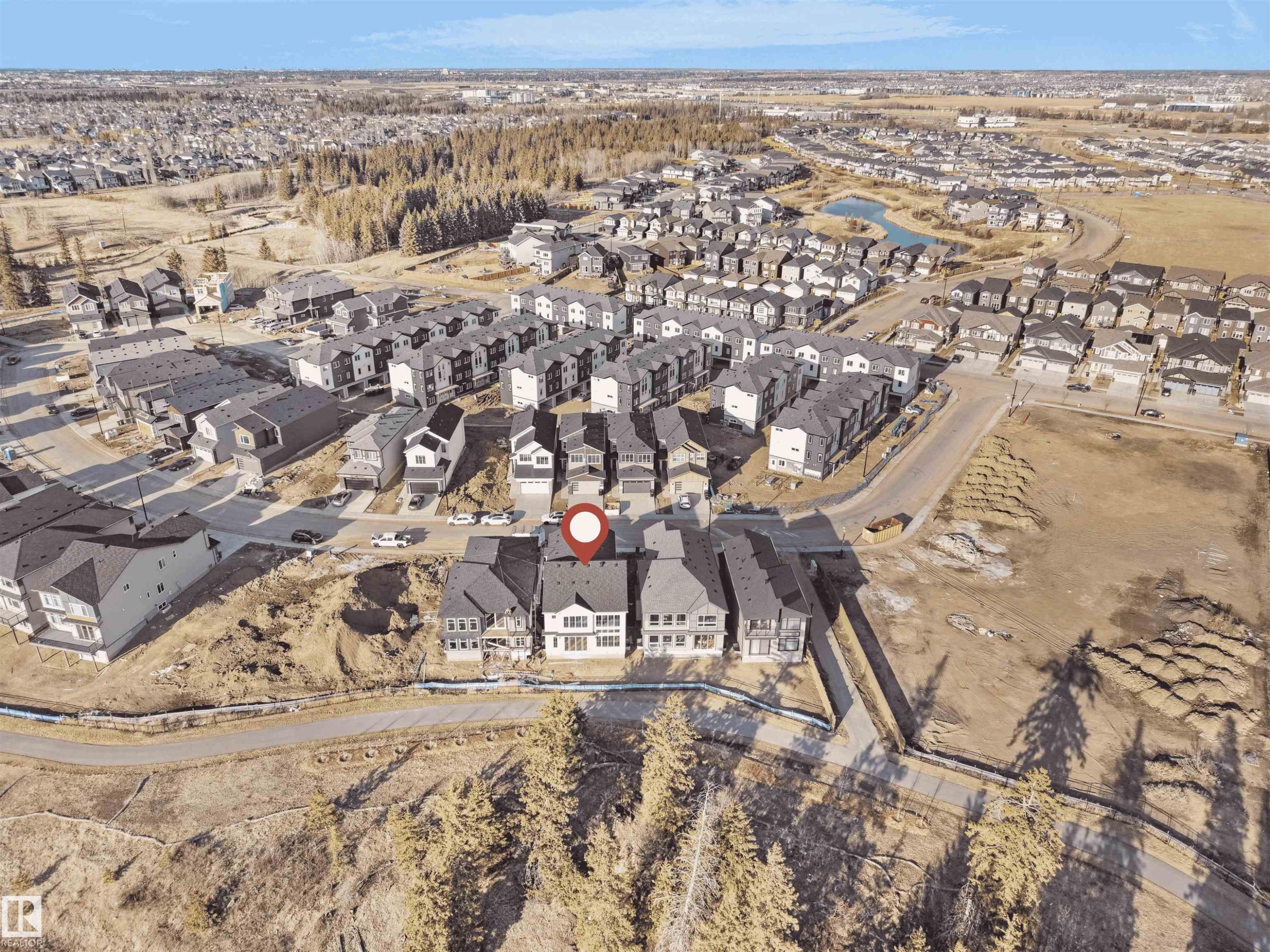 Aerial perspective showcasing a residential development with varied housing styles - 2070 Collip Crescent Sw, Edmonton, AB - Outdoor With View