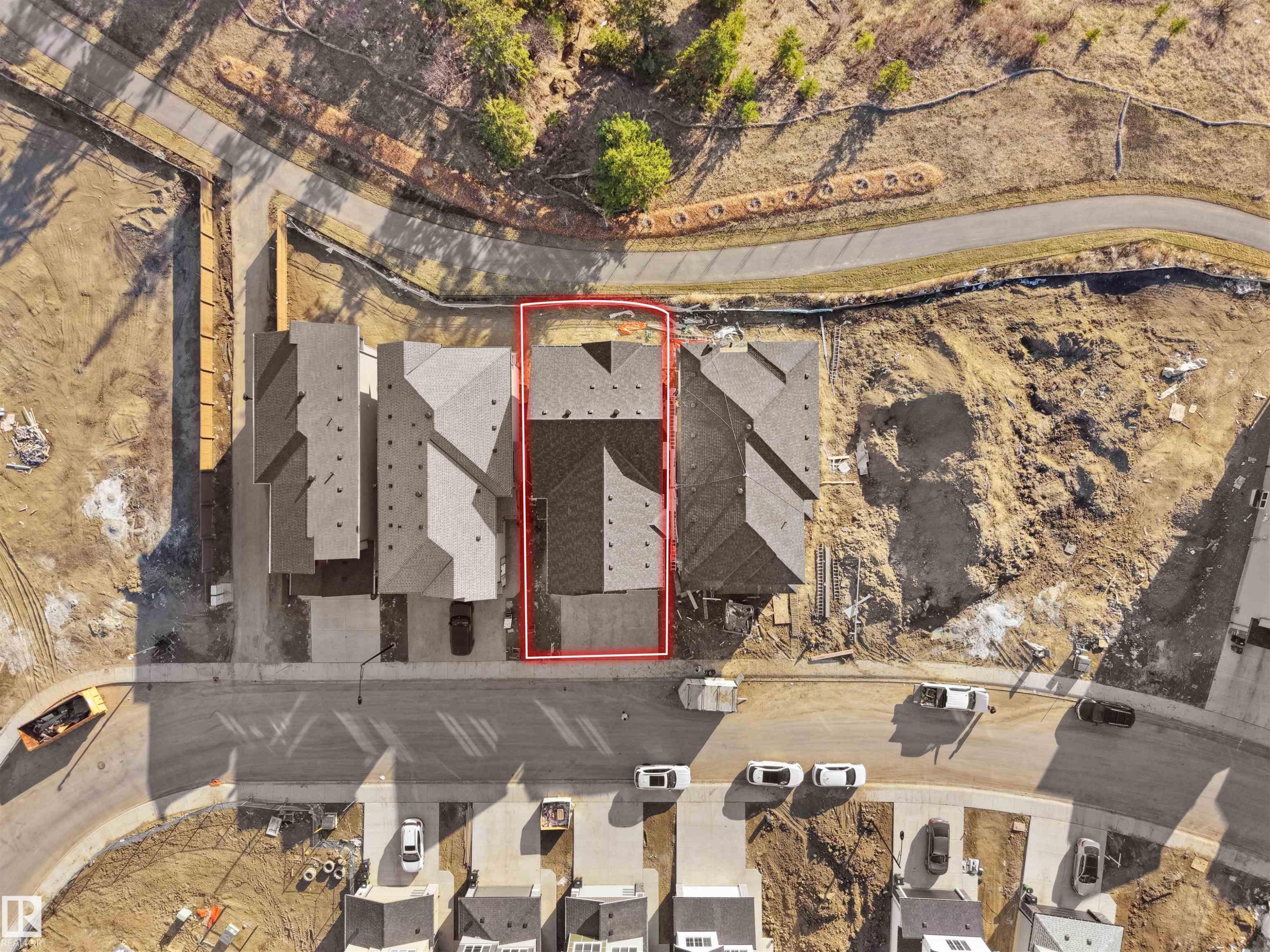 Two-story residential structure with a gabled roofline and attached garage, situated on a lot outlined in red - 2070 Collip Crescent Sw, Edmonton, AB - Photo Showing Other Room