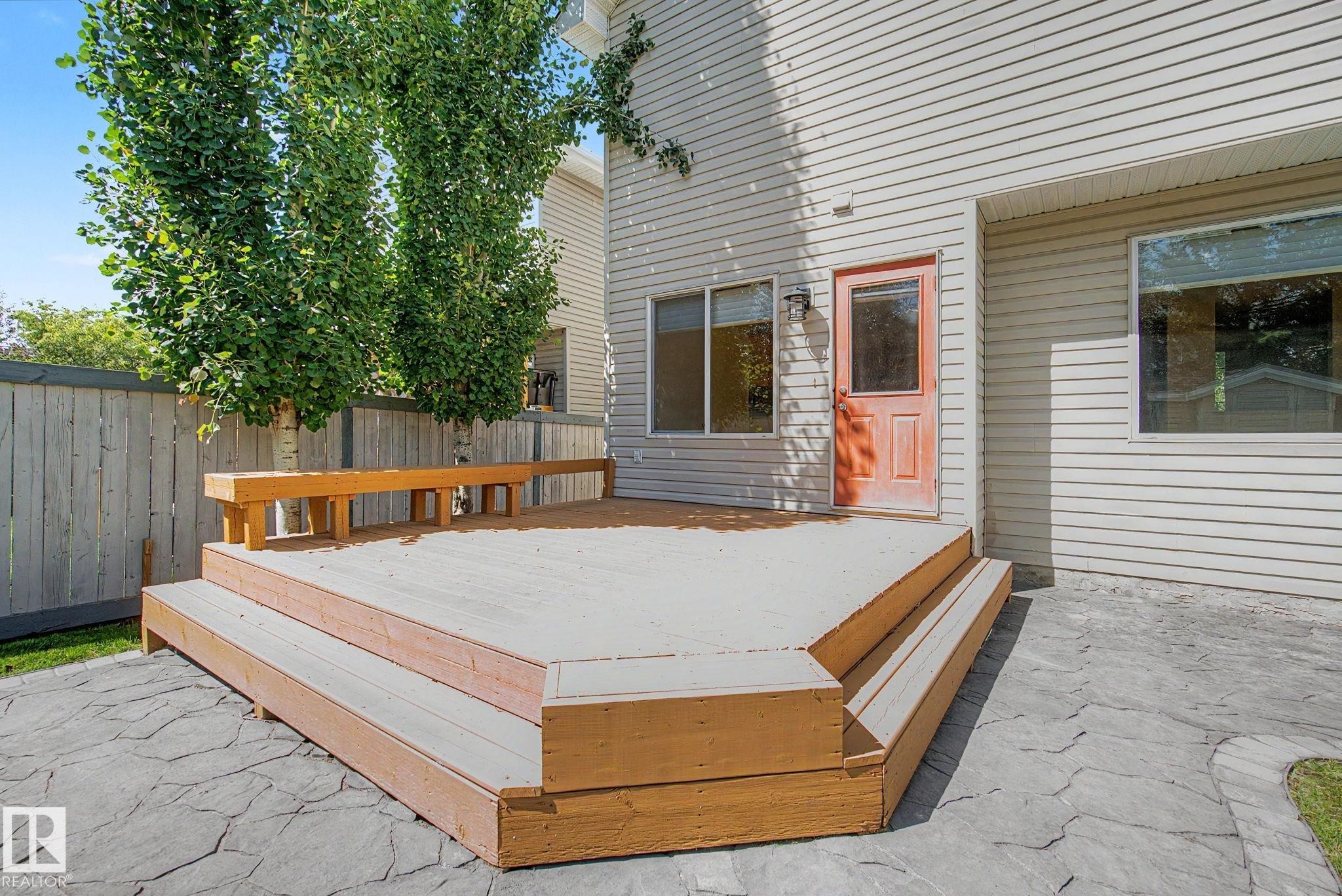 Multi-level wood deck with built-in bench seating - 8311 11 Avenue, Edmonton, AB