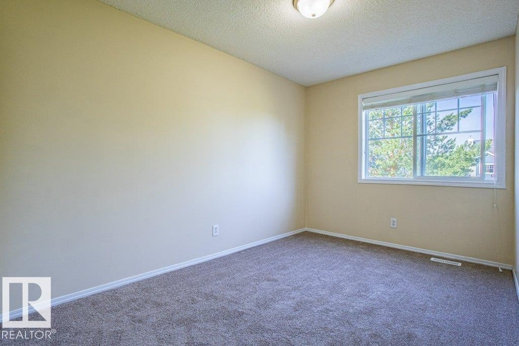 Bedroom 3 - 41 8304 11 Avenue, Edmonton, AB - Indoor Photo Showing Other Room