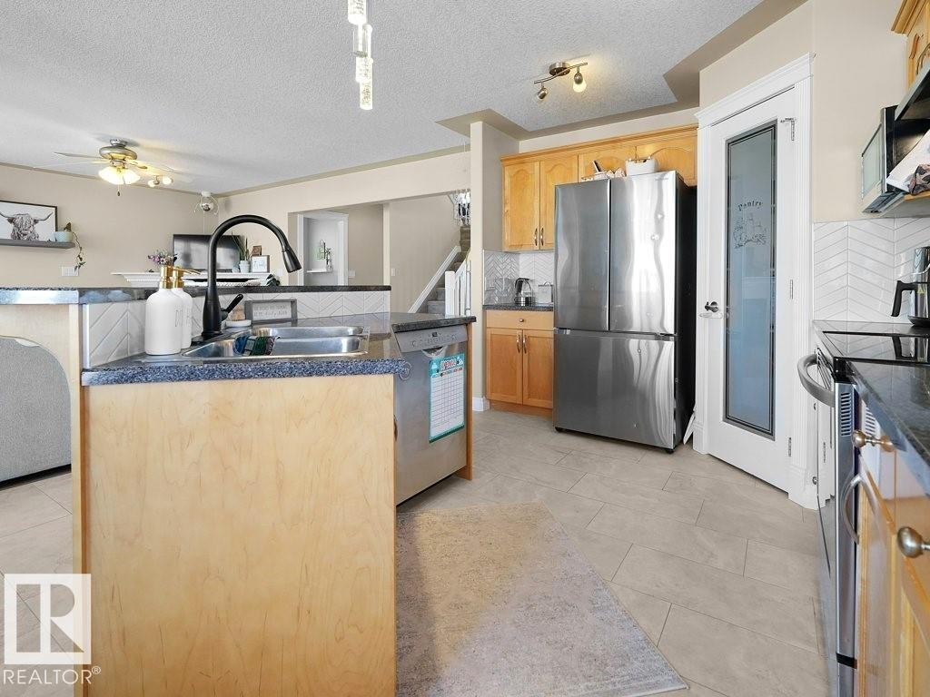 1476 Mcmillian Way, Edmonton, AB - Indoor Photo Showing Kitchen With Stainless Steel Kitchen With Double Sink