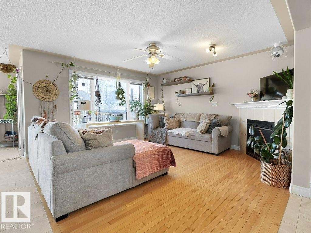 1476 Mcmillian Way, Edmonton, AB - Indoor Photo Showing Living Room With Fireplace