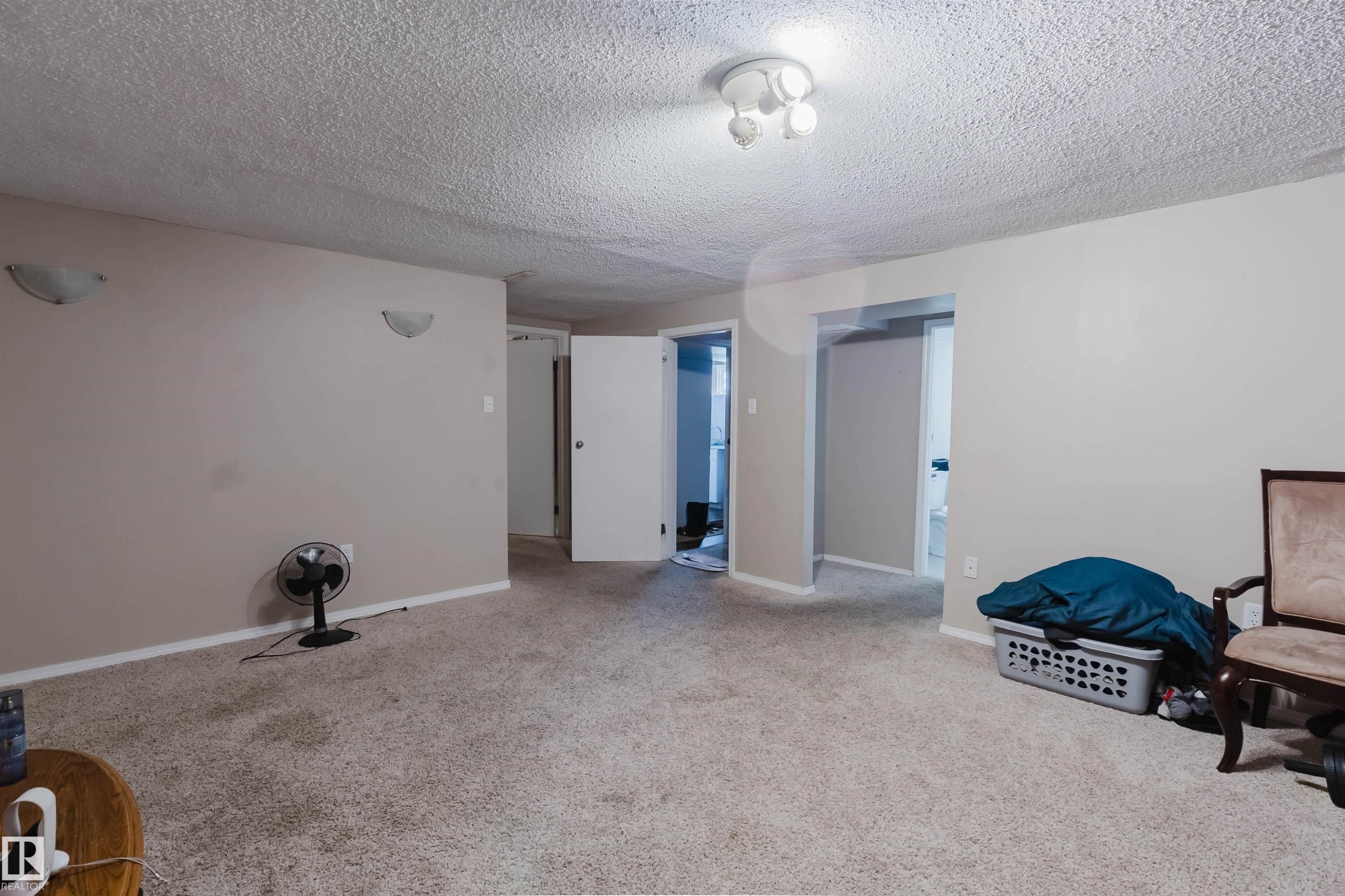 Carpeted room with neutral painted walls - 10519 36A Avenue, Edmonton, AB - Indoor