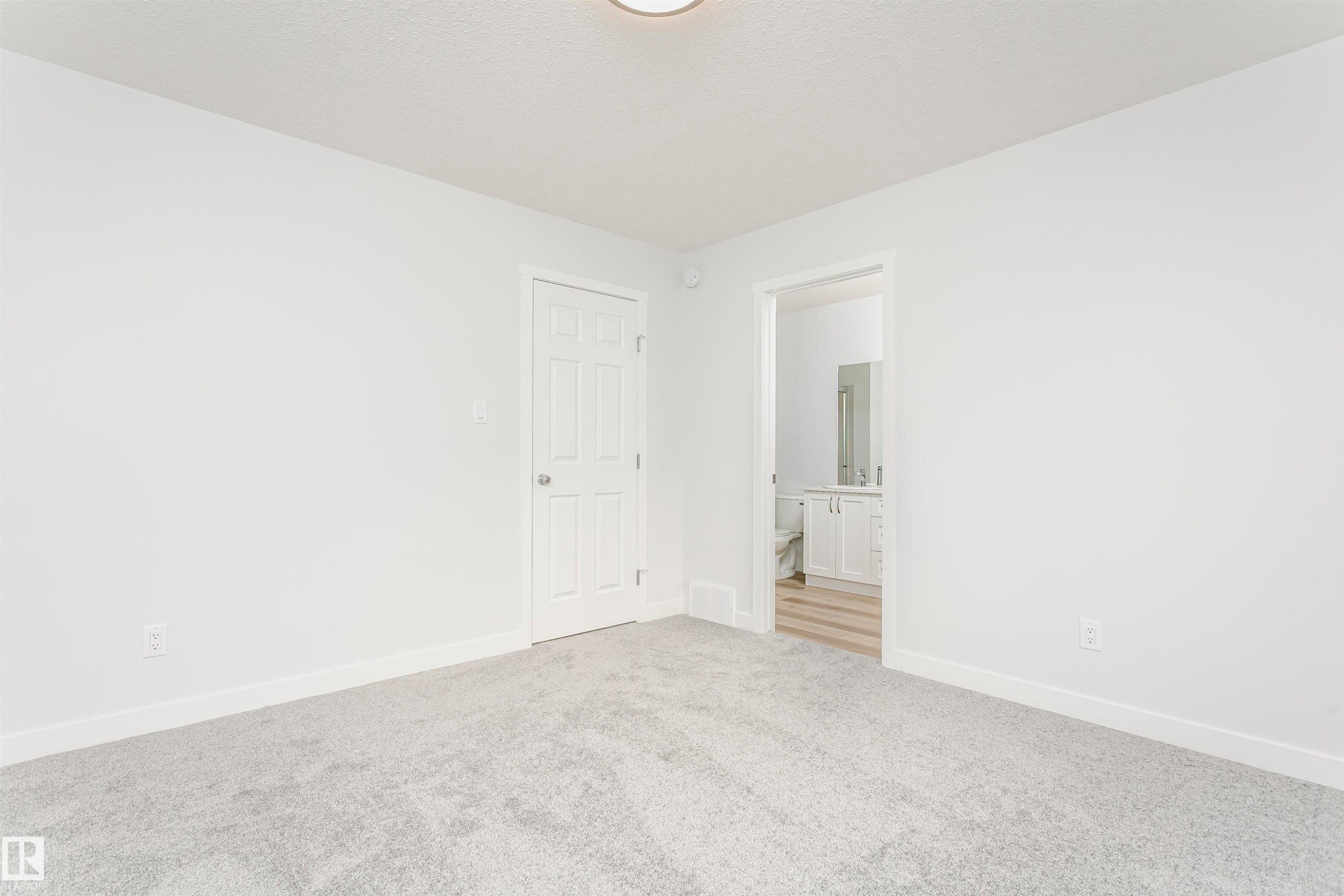 Light grey carpeting in a room featuring white walls and trim - 9564 Carson Bend Bend, Edmonton, AB - Indoor Photo Showing Other Room