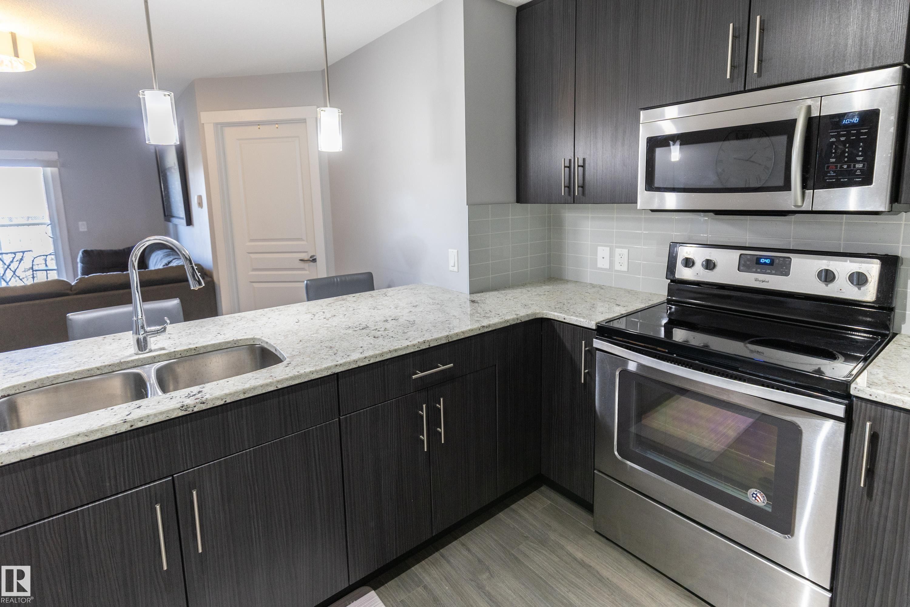 107 3670 139 Avenue, Edmonton, AB - Indoor Photo Showing Kitchen With Stainless Steel Kitchen With Double Sink With Upgraded Kitchen