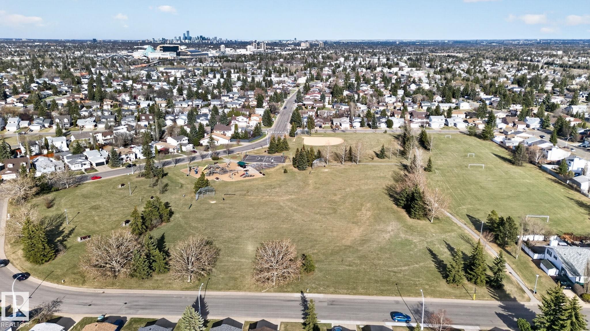 Expansive green space featuring a baseball diamond, multiple soccer fields, and a playground area - 8403 190 Street, Edmonton, AB - Outdoor With View