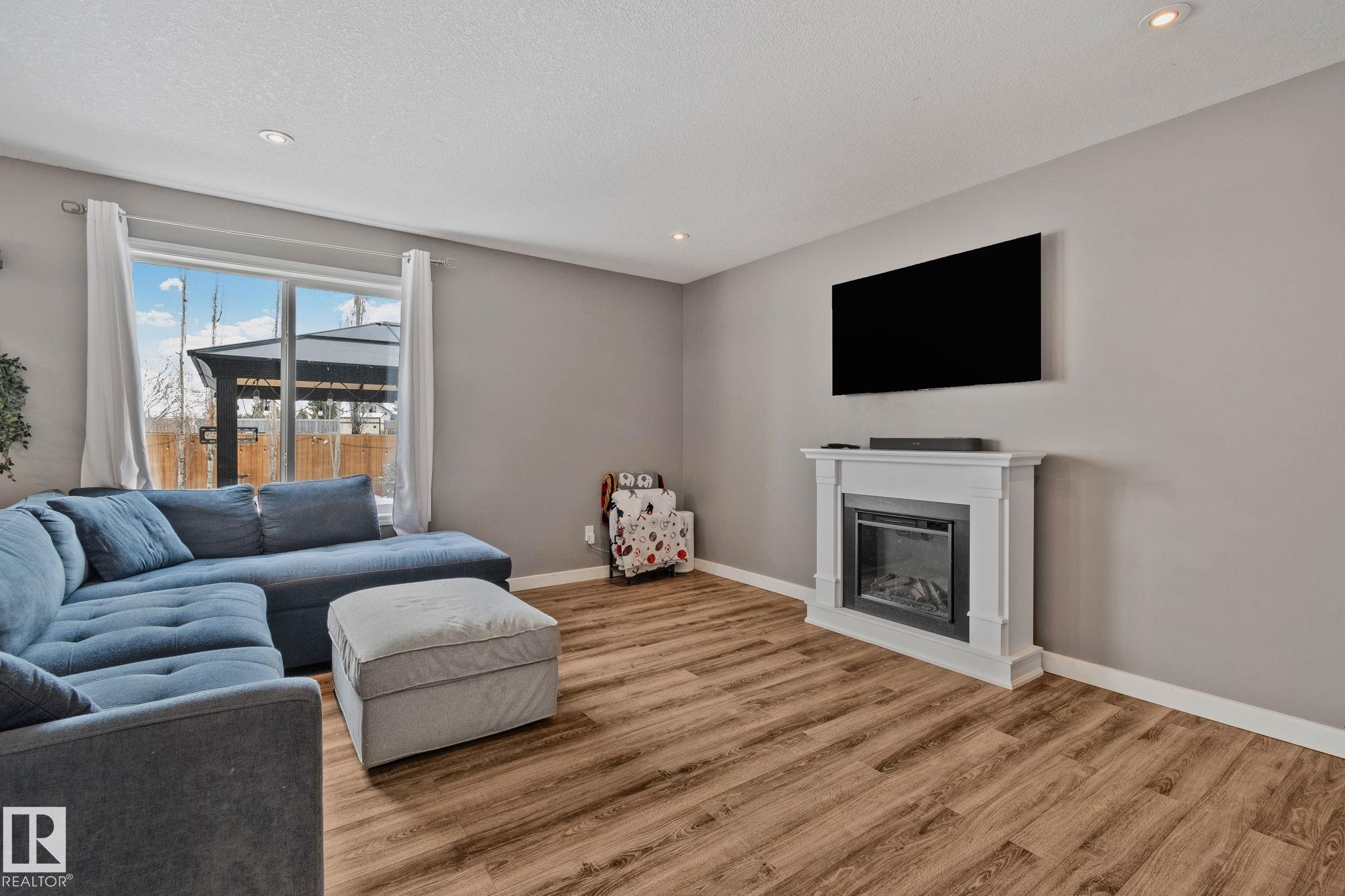 3711 161 Avenue, Edmonton, AB - Indoor Photo Showing Living Room With Fireplace