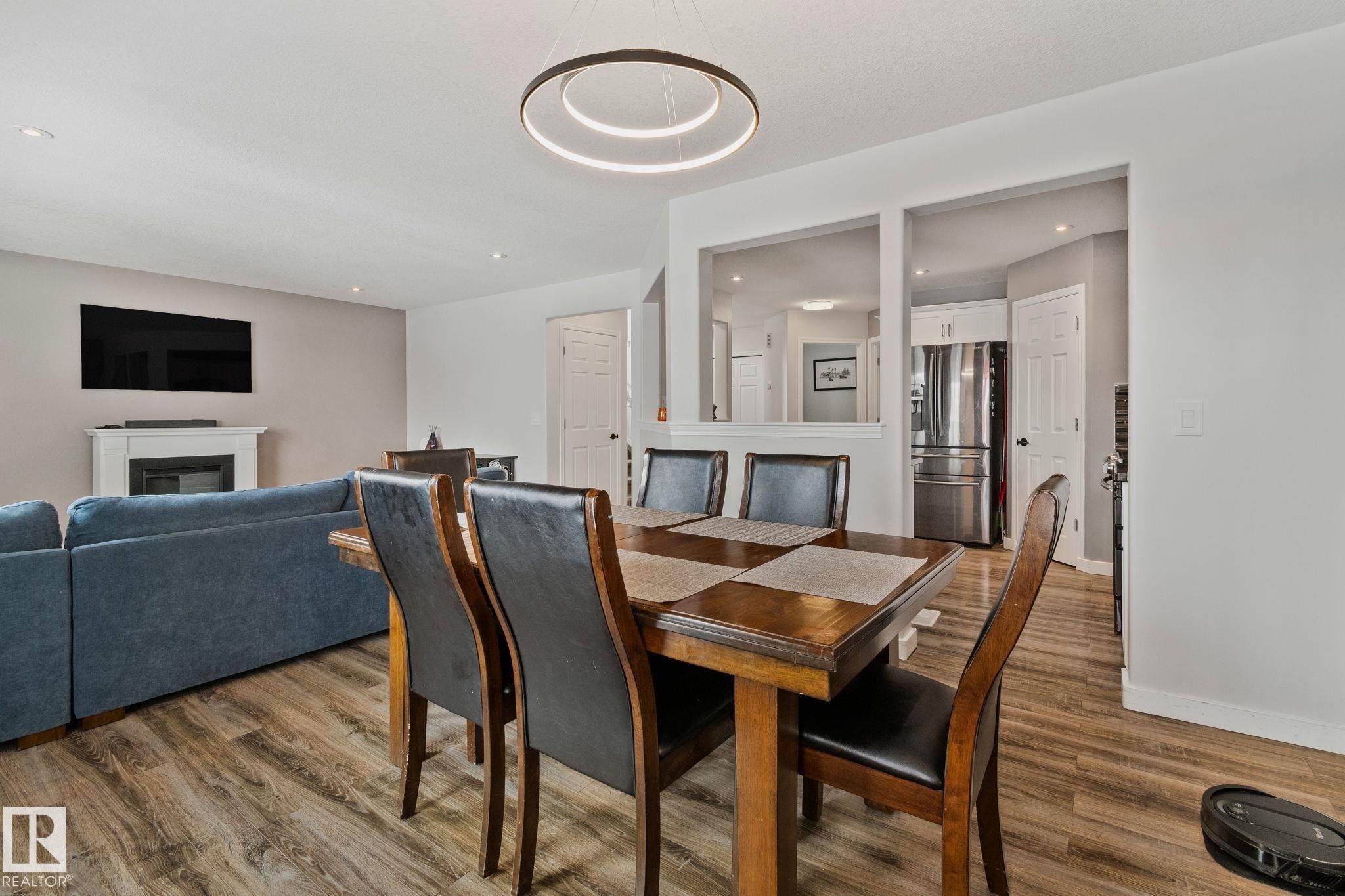 3711 161 Avenue, Edmonton, AB - Indoor Photo Showing Dining Room With Fireplace