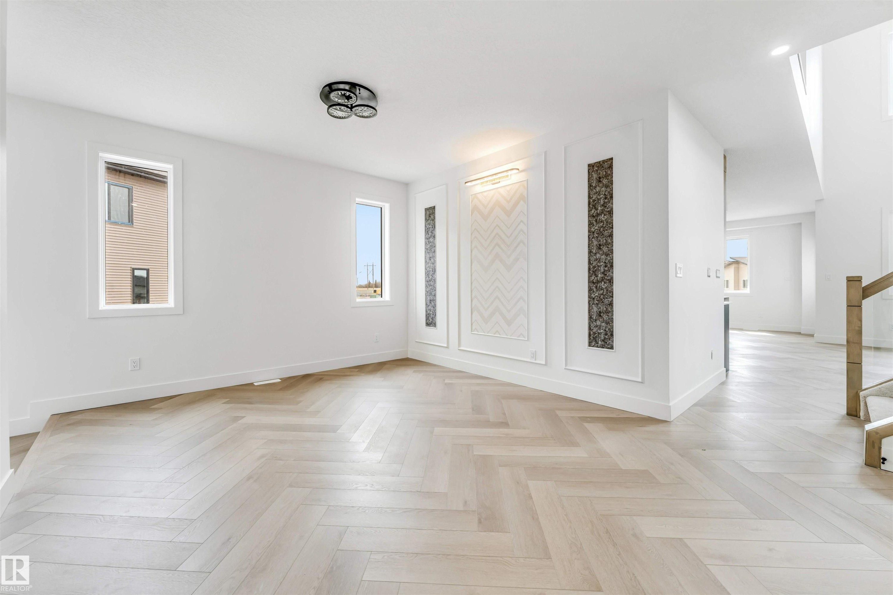 Light wood-finish herringbone flooring throughout - 4006 35 St, Beaumont, AB - Indoor Photo Showing Other Room