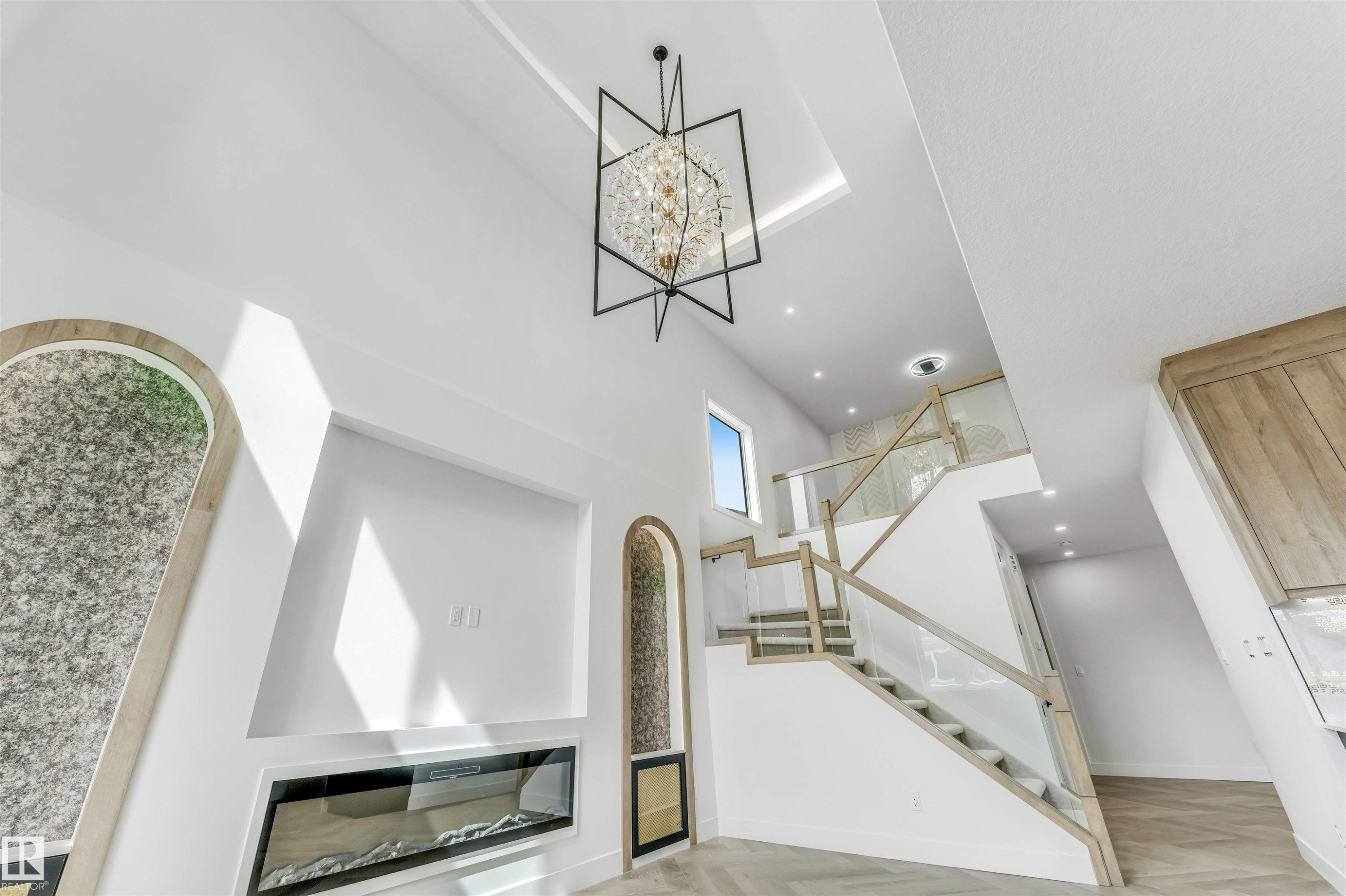Soaring ceilings featuring a modern chandelier and recessed lighting - 4006 35 St, Beaumont, AB - Indoor Photo Showing Other Room