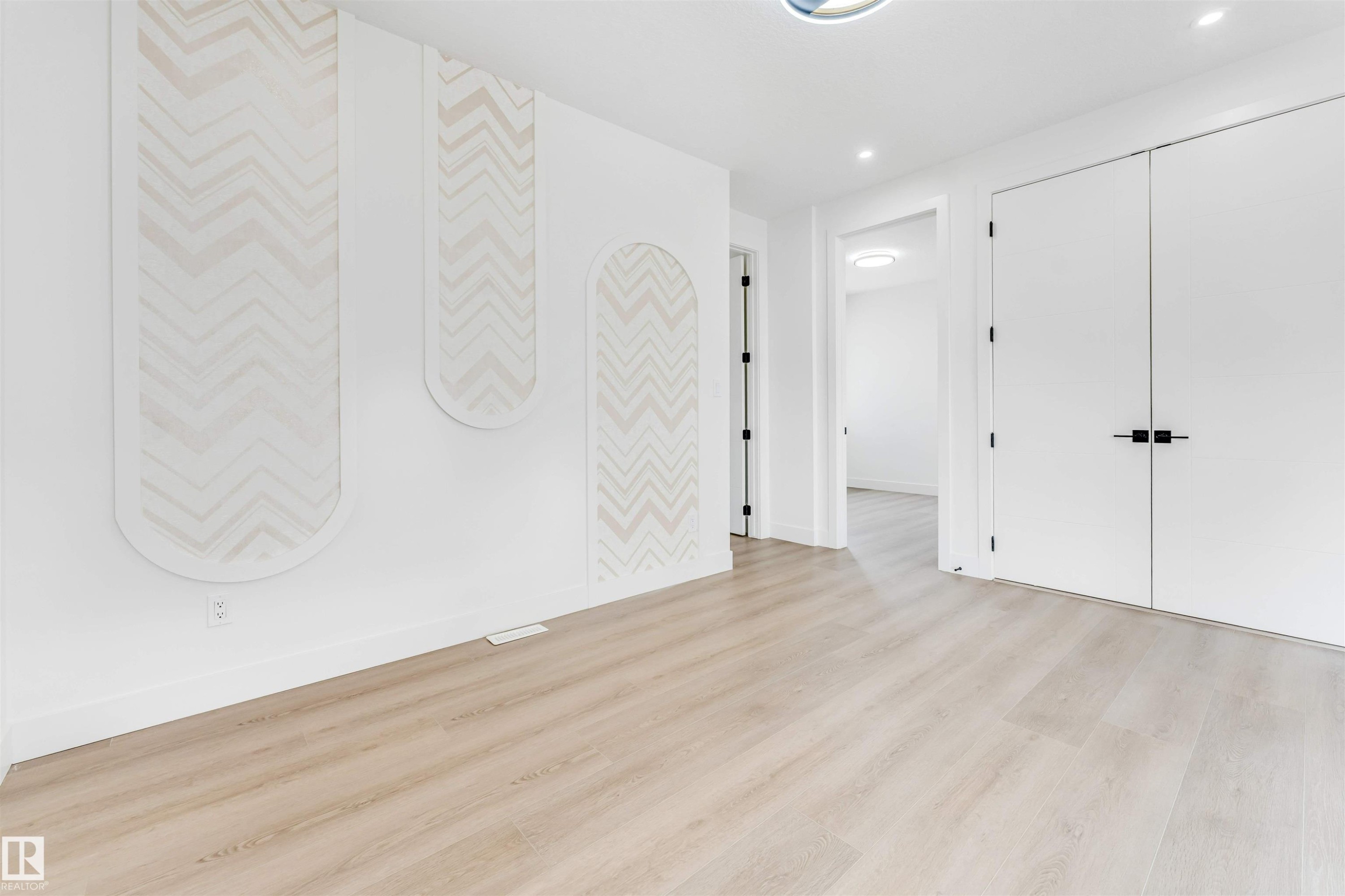 Light wood-finish flooring extending throughout the space - 4006 35 St, Beaumont, AB - Indoor Photo Showing Other Room