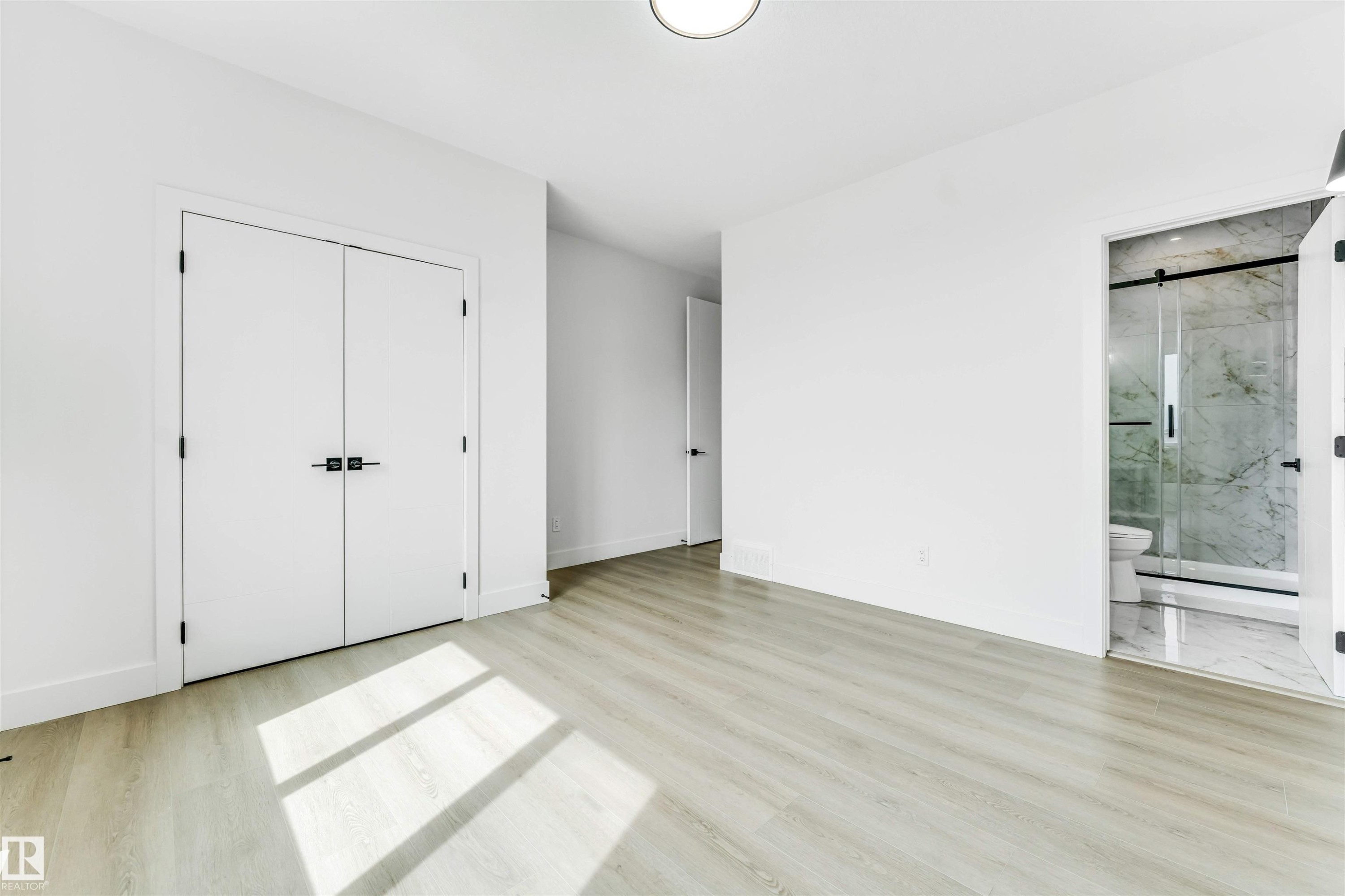 Bright interior space featuring light wood-finish flooring - 4006 35 St, Beaumont, AB - Indoor Photo Showing Other Room