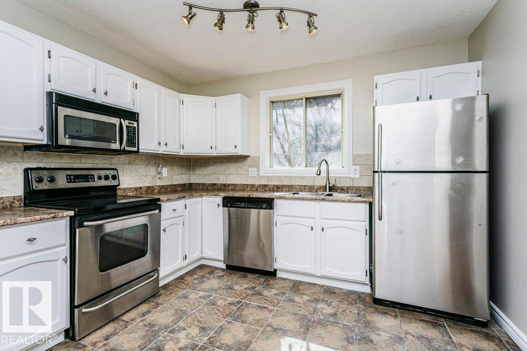 14304 32 Street, Edmonton, AB - Indoor Photo Showing Kitchen With Double Sink