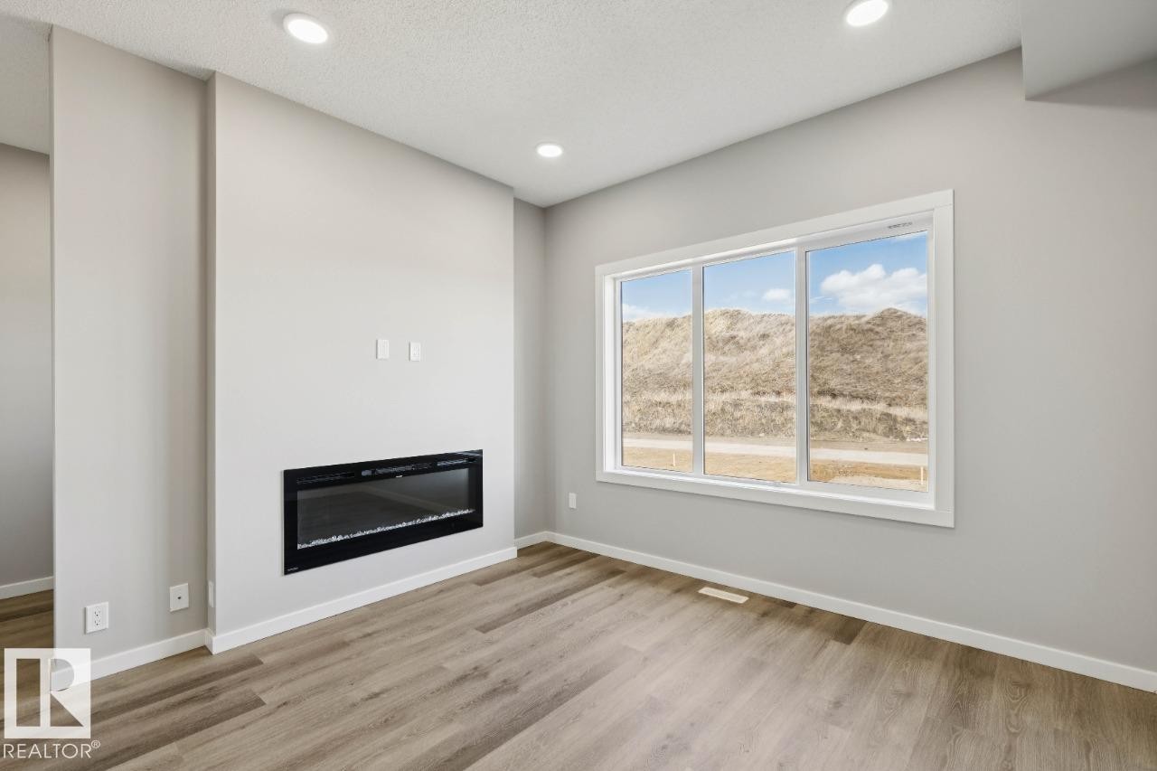 309 Edgemont Drive, Edmonton, AB - Indoor Photo Showing Other Room With Fireplace