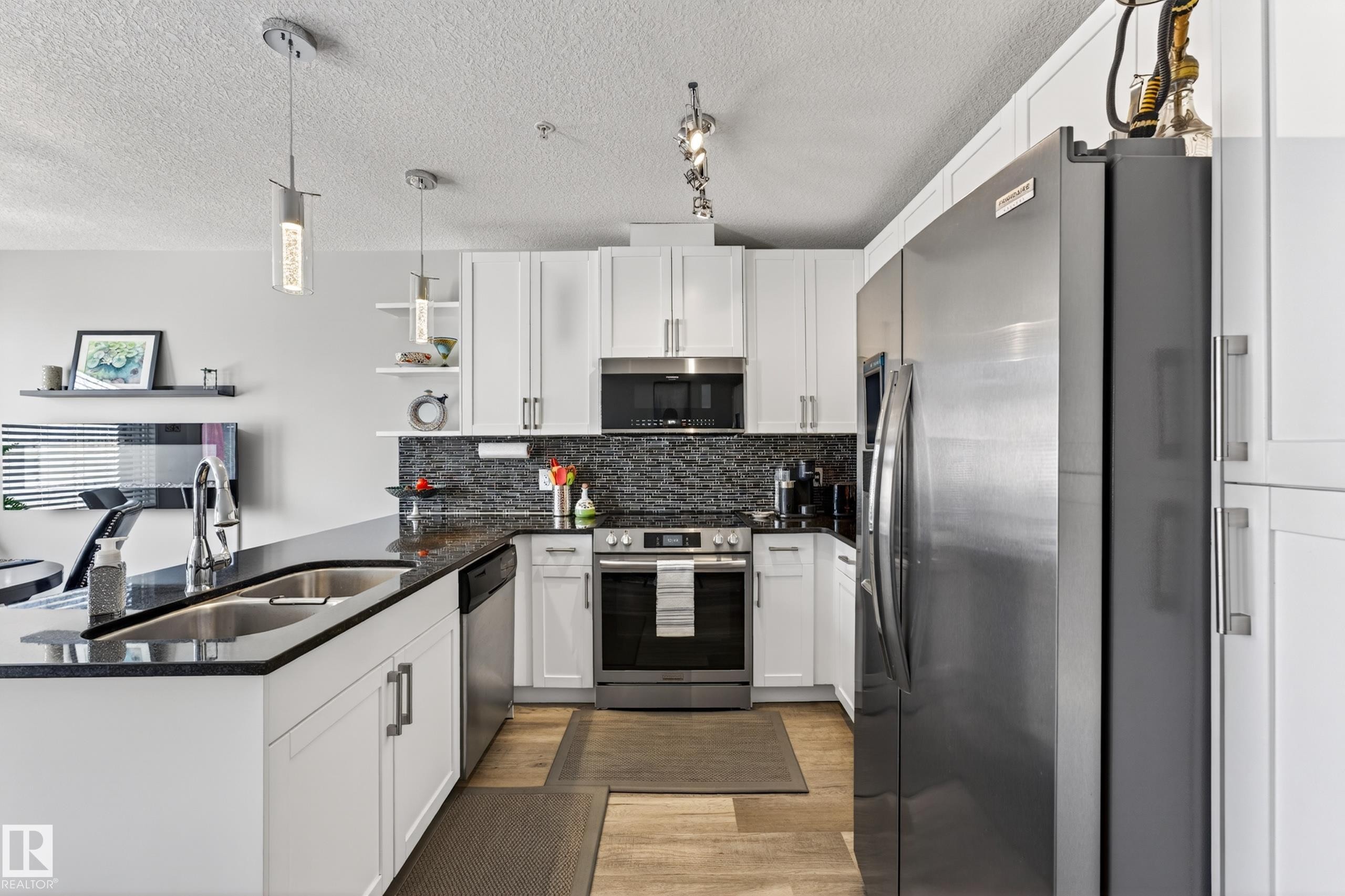 109 5151 Windermere Boulevard, Edmonton, AB - Indoor Photo Showing Kitchen With Double Sink With Upgraded Kitchen